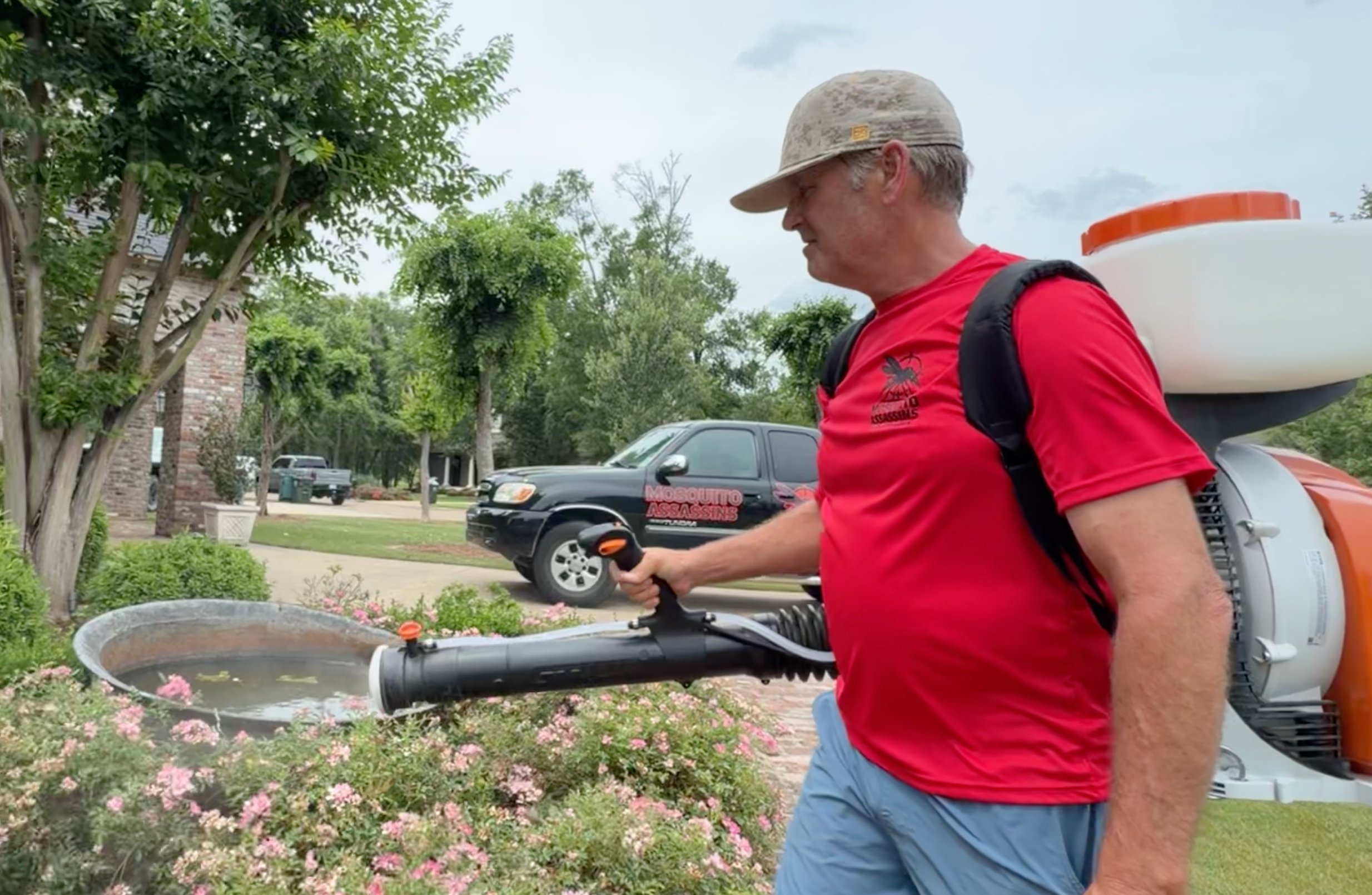 Mosquito Assassins technician treating a yard in Monroe Louisiana