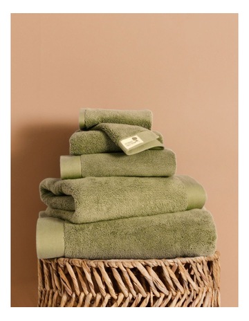 Australian Cotton Towel Range in Shrub Background Image