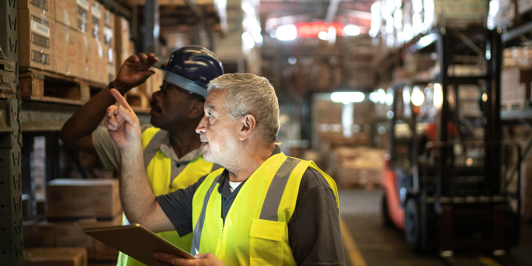 Two men working in a factory