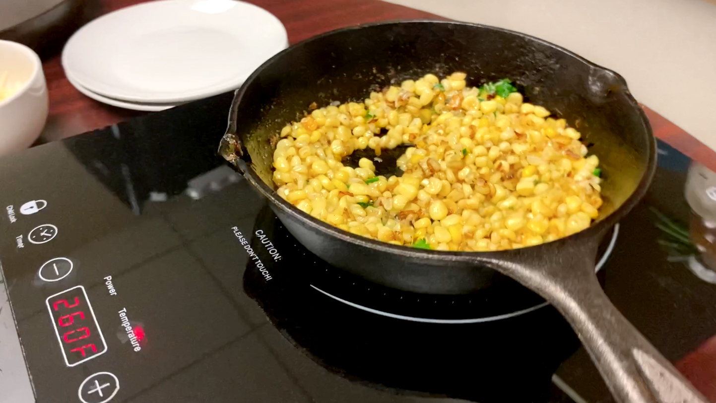 Cooking corn in an iron skilled on an induction cooktop