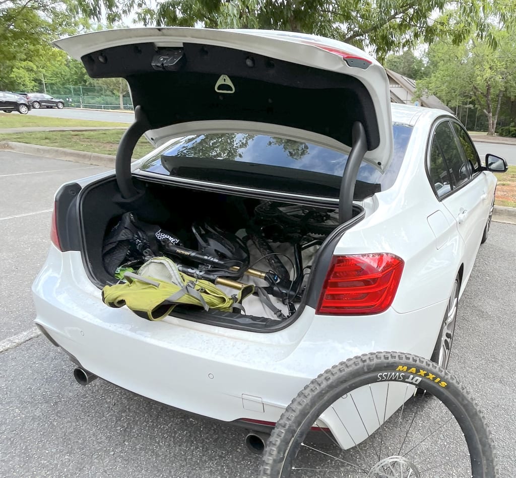 How I used to transport my mountain bike in my old BMW. Worked great, but clearly not possible in the Cayman.