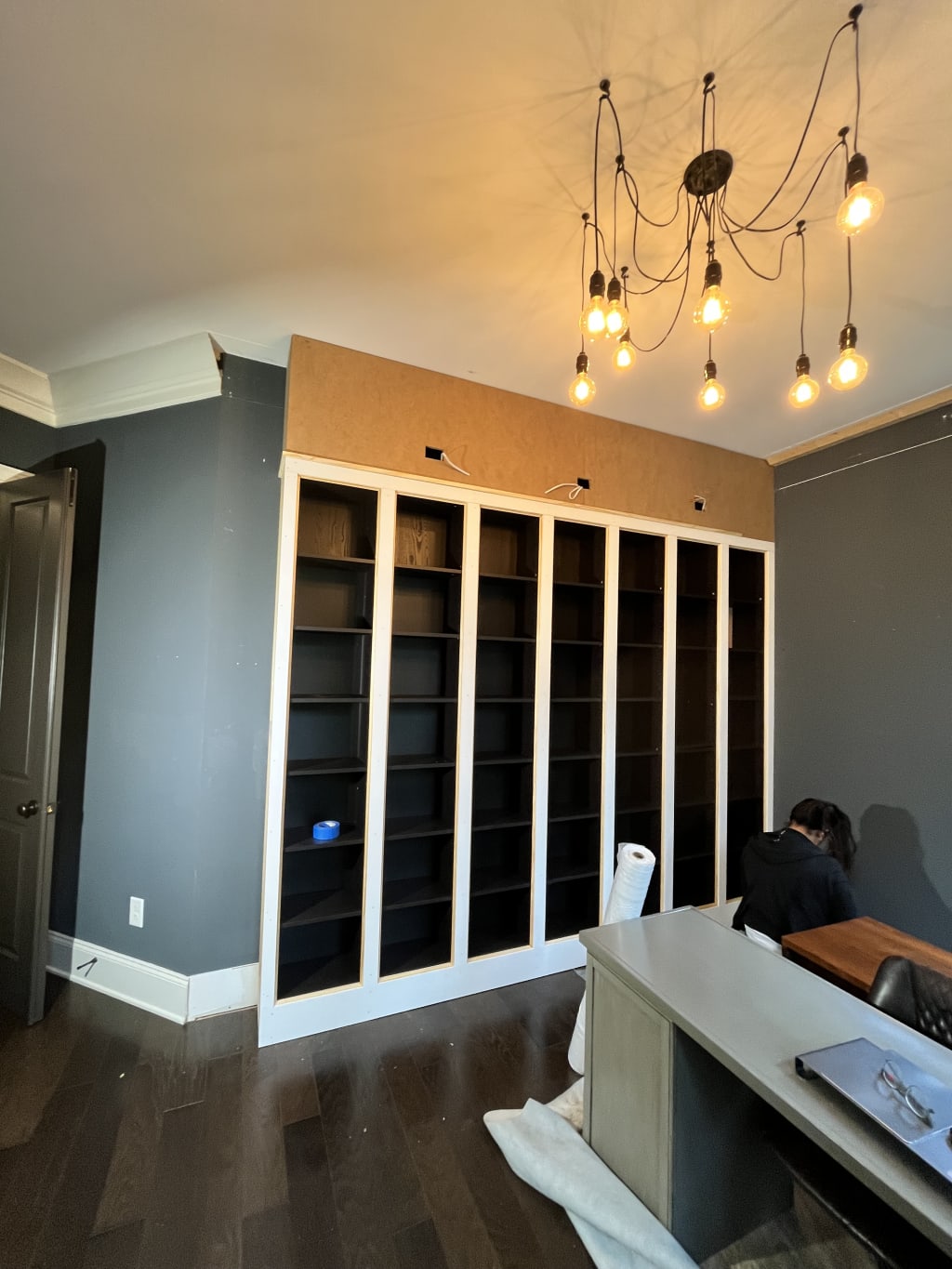 Painter is masking in preparation for the job.