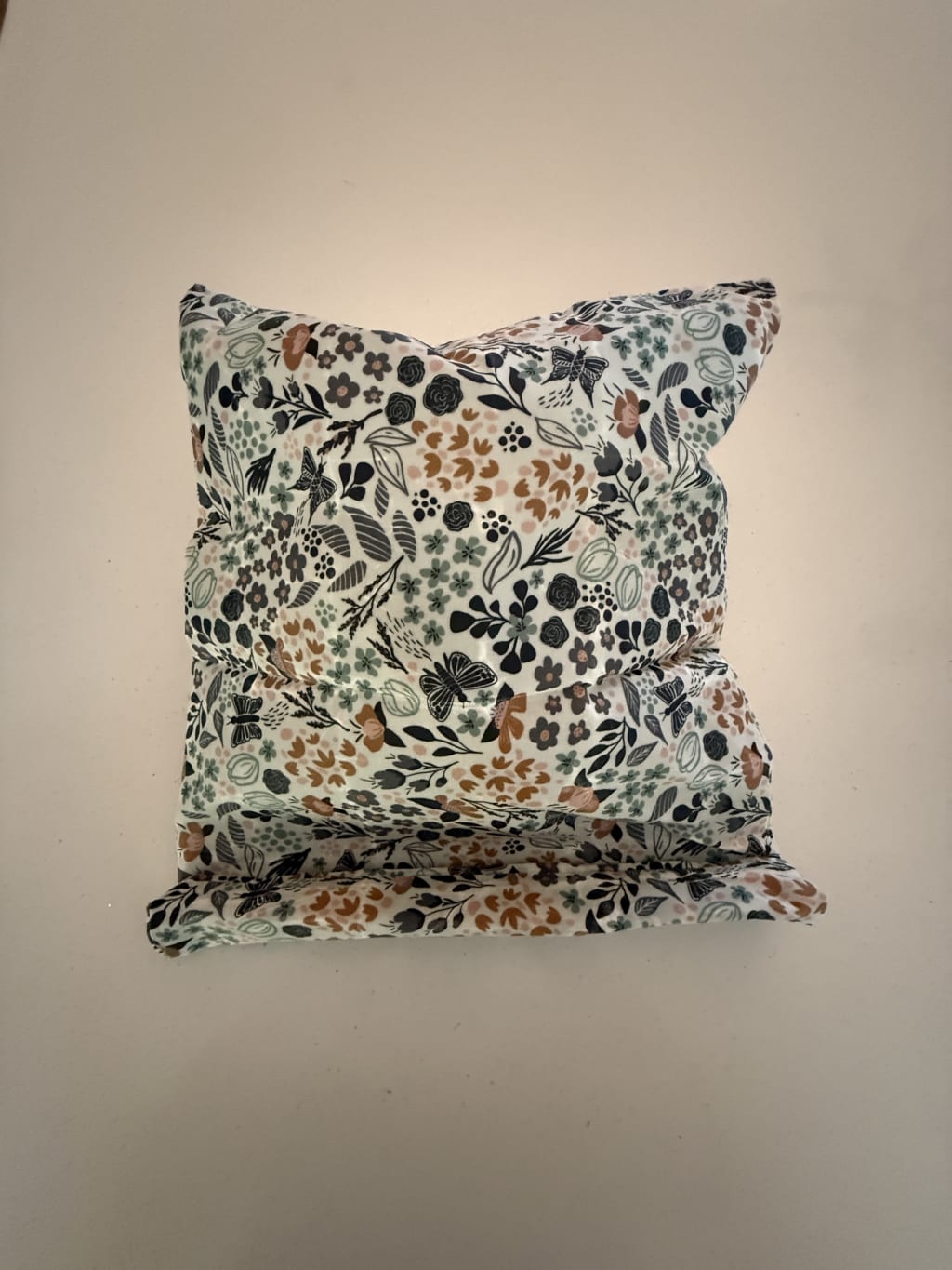 The wax hard material can get folded on its own, which is nice to keep the bread fresh and protected from drying up in open air and the elements.