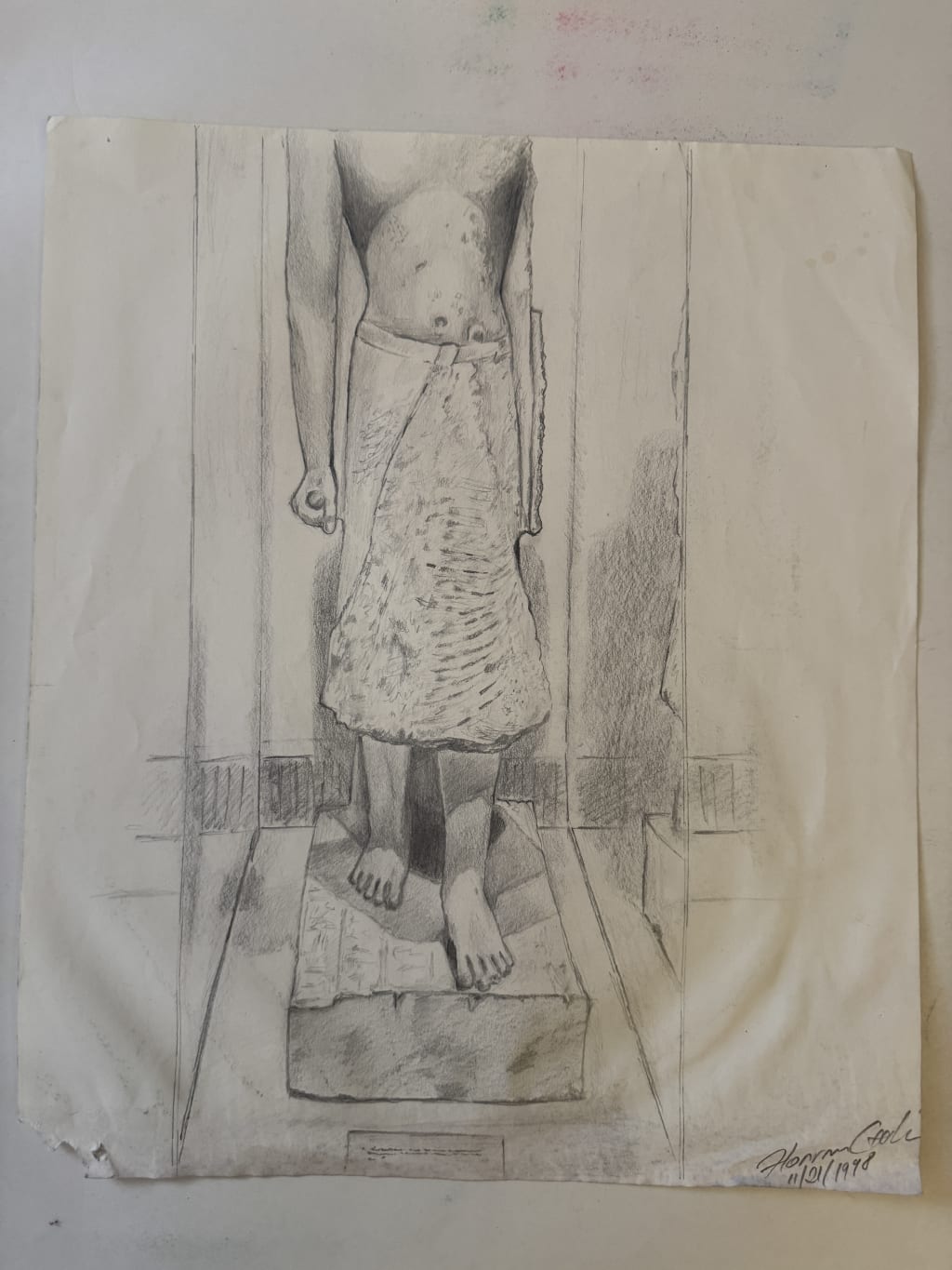 An egiptean statue study.  We were asked to go to the DIA (Detroit Institute of Art) and draw a few of the sculptures there, at  choice.  I remember spending a few hours on the bench and floor near by this statue, when I drew it.  Next time I go to the DIA I will look for the statue and take a picture to have alongside the drawing.