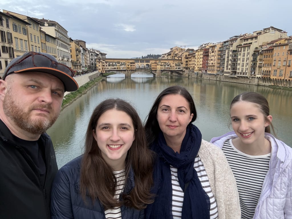 We, the Gales on a bridge taking a selfie with the one famous bridge in the background.