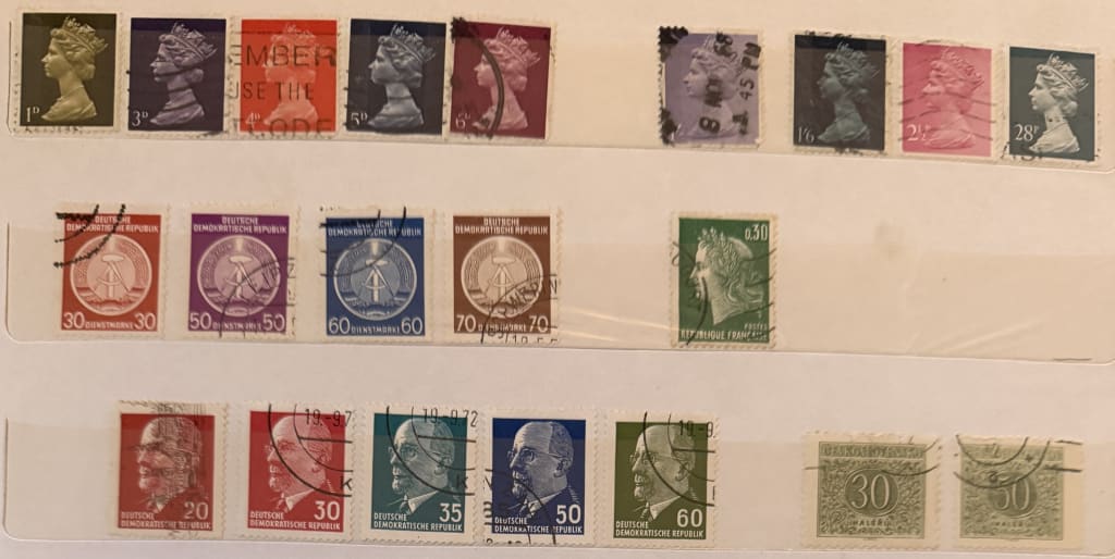Collection of vintage European postage stamps from the UK, Germany, France, and Czechoslovakia.
