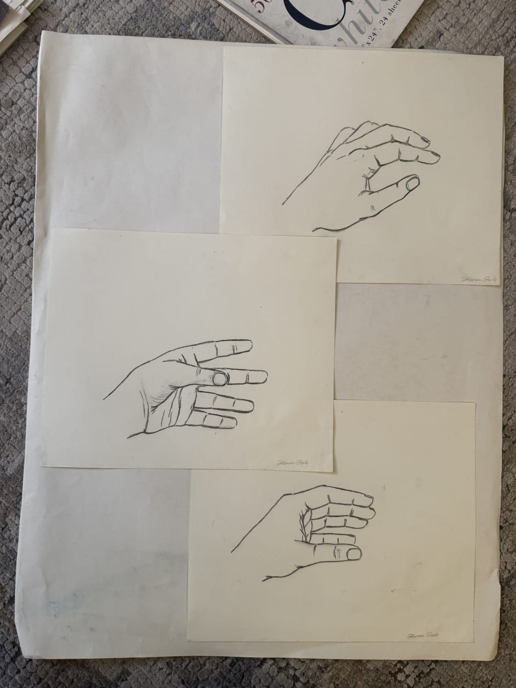 Three detailed pencil sketches of hands on separate sheets, signed by artist Horin Gale.