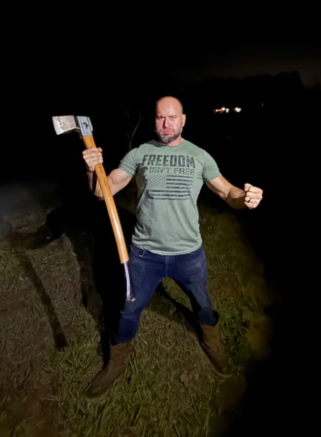 The Hun, again - flexing.  The axe is the only thing that makes him looks strong in this photo.