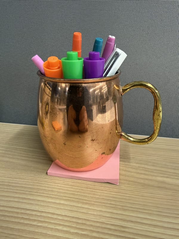 Golden mug with markers