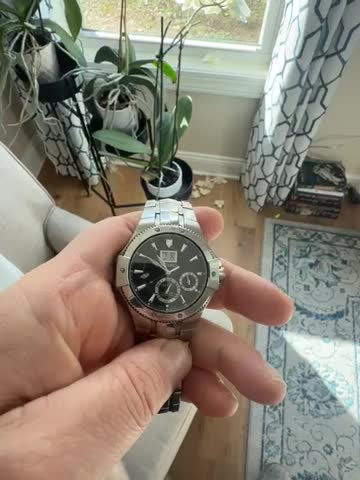 Good news before the end of the year.  After wearing the watch a lot for a couple days or so, the seconds hand started working normally.  This means the watch is working correctly.