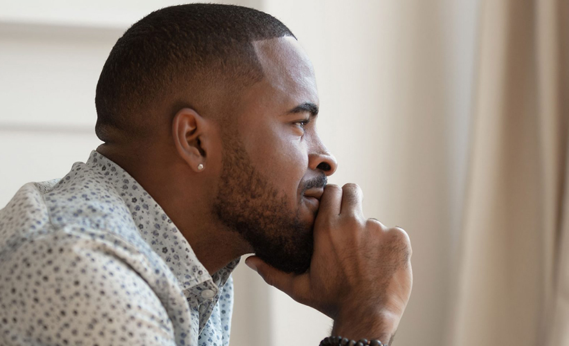 Man thinking how to get cheap flights to his destination - Catch Flights Not Feelings