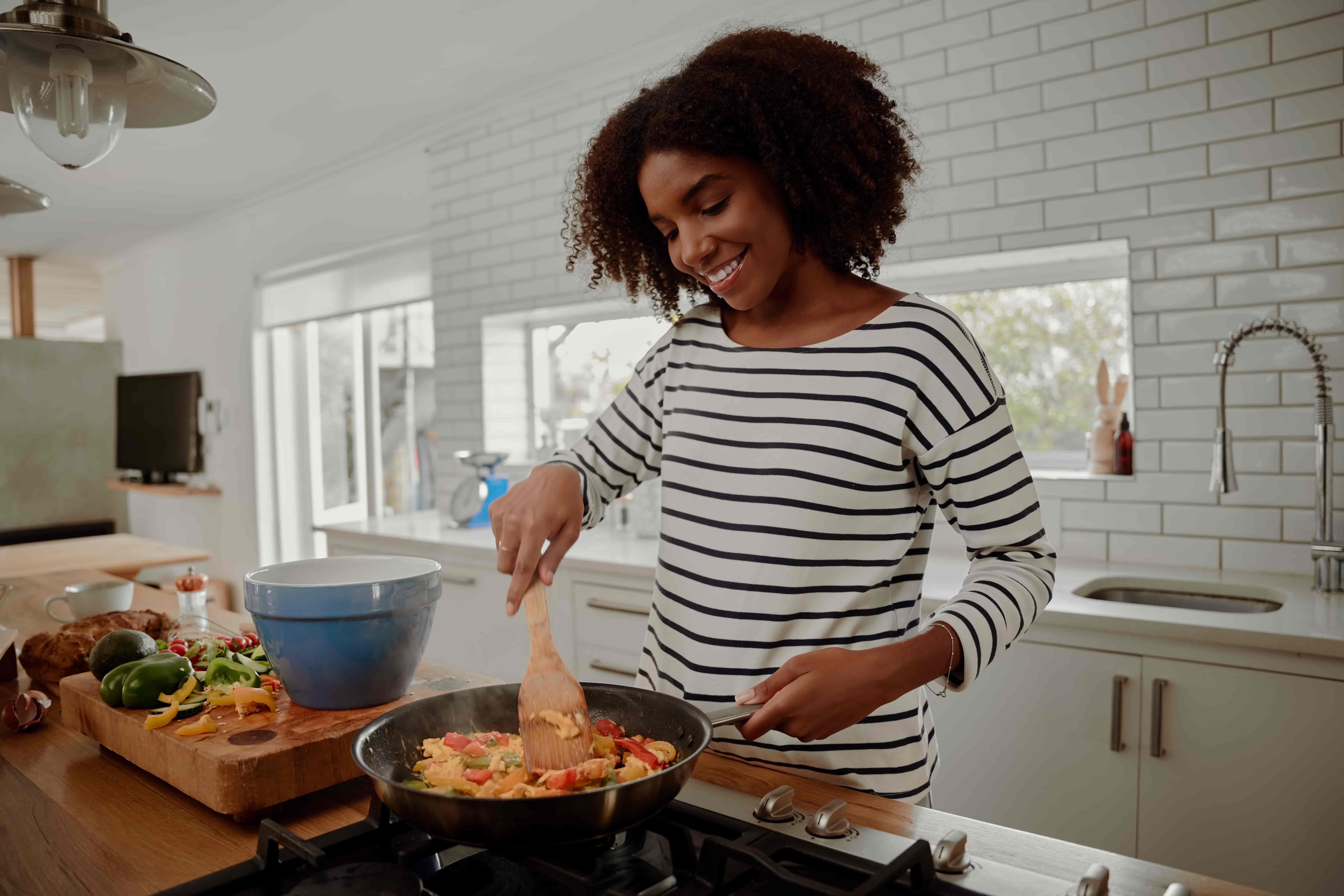 Lady cooking to save extra costs