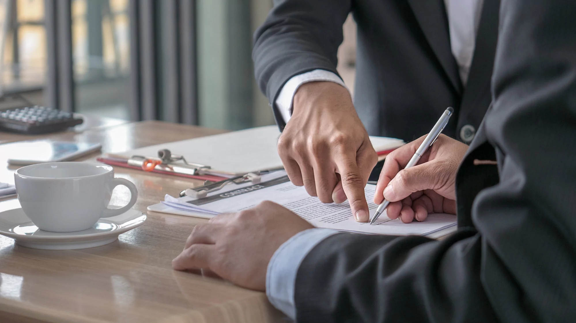 Business handshake representing joint venture partnership