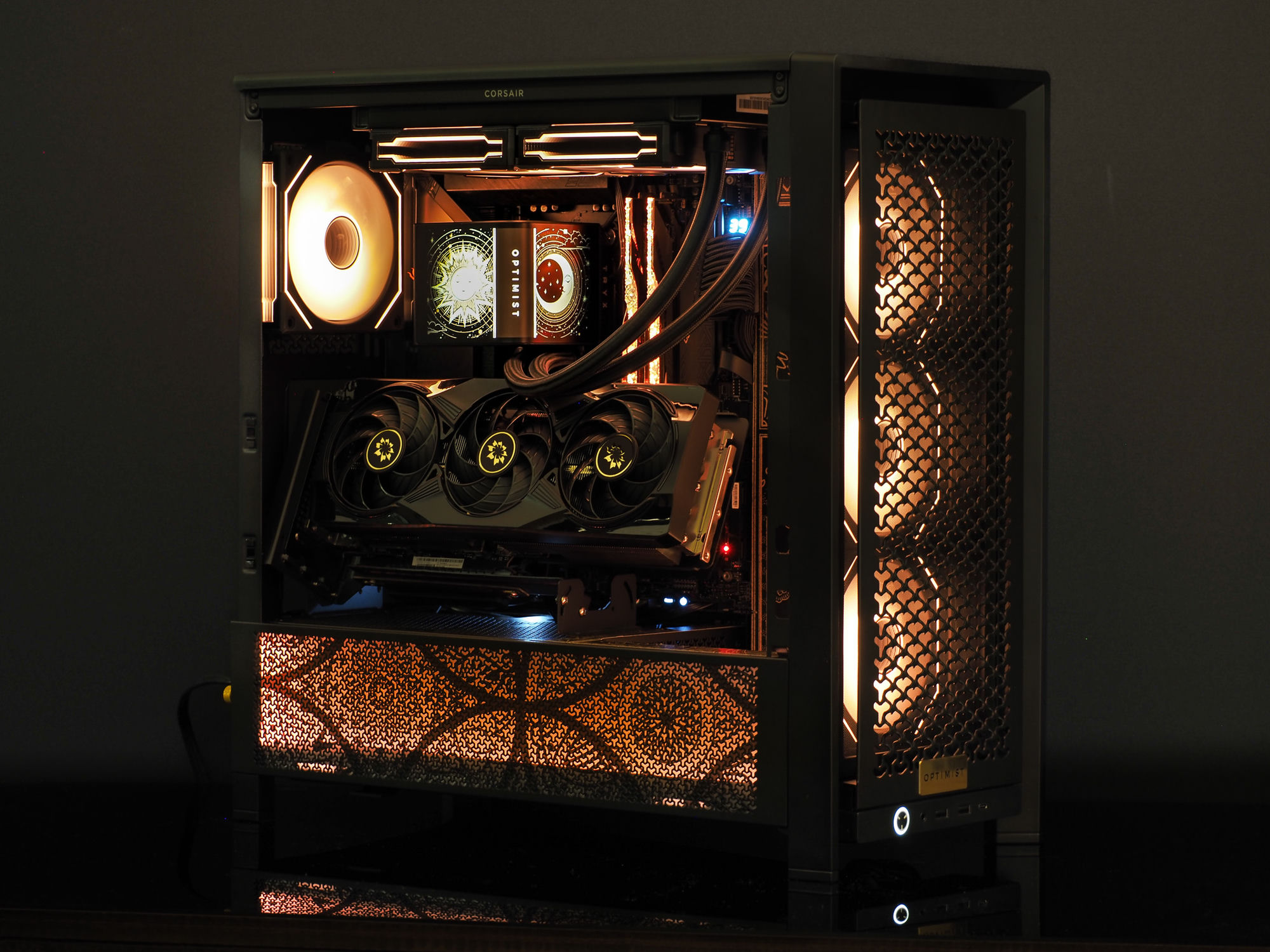 The Orion system — a sub-10-litre art-deco build, front panel perforated and lit warm gold