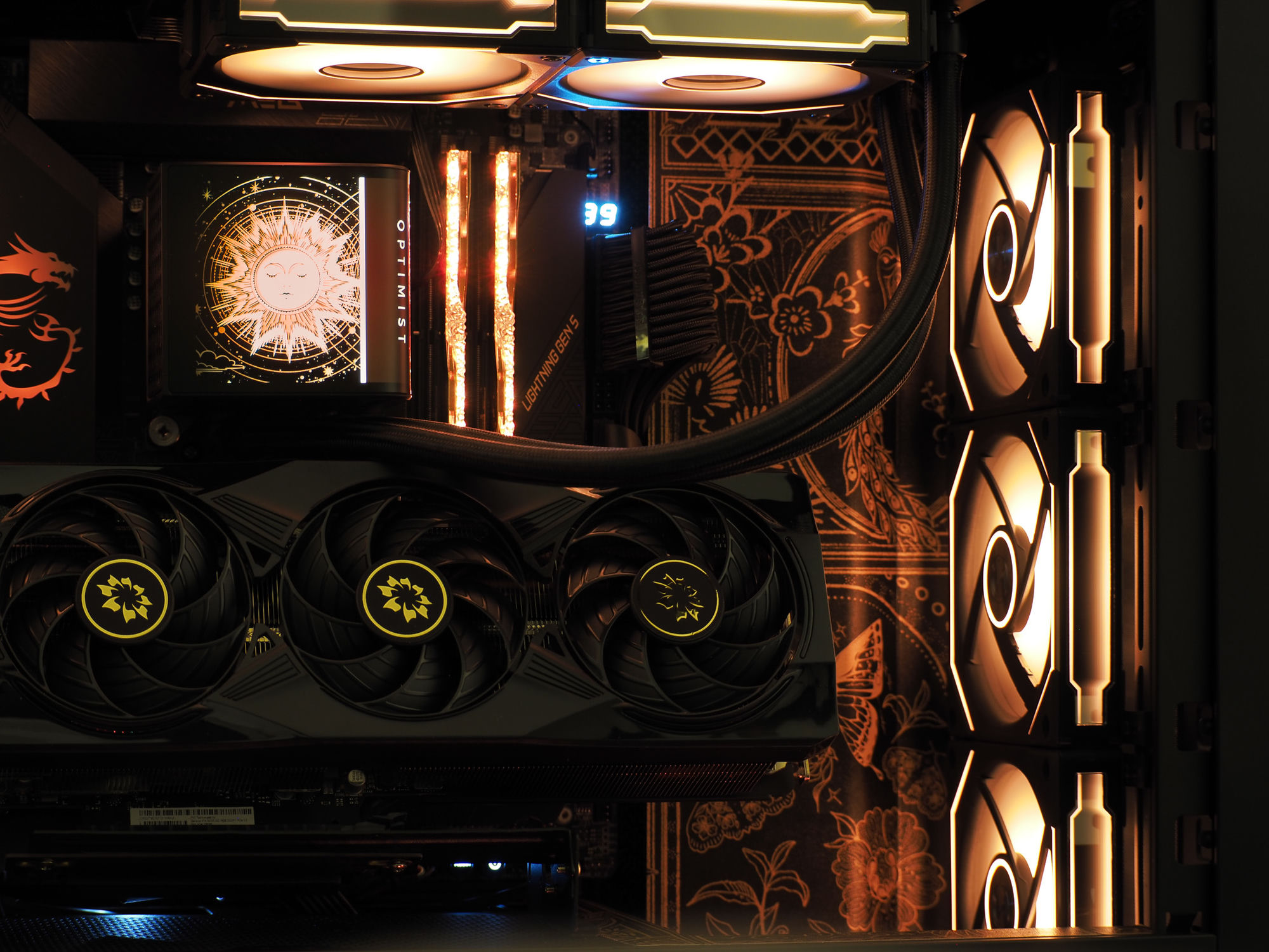 The Orion interior lit in one warm gold — cooler screen, illuminated memory, and engraved backplate
