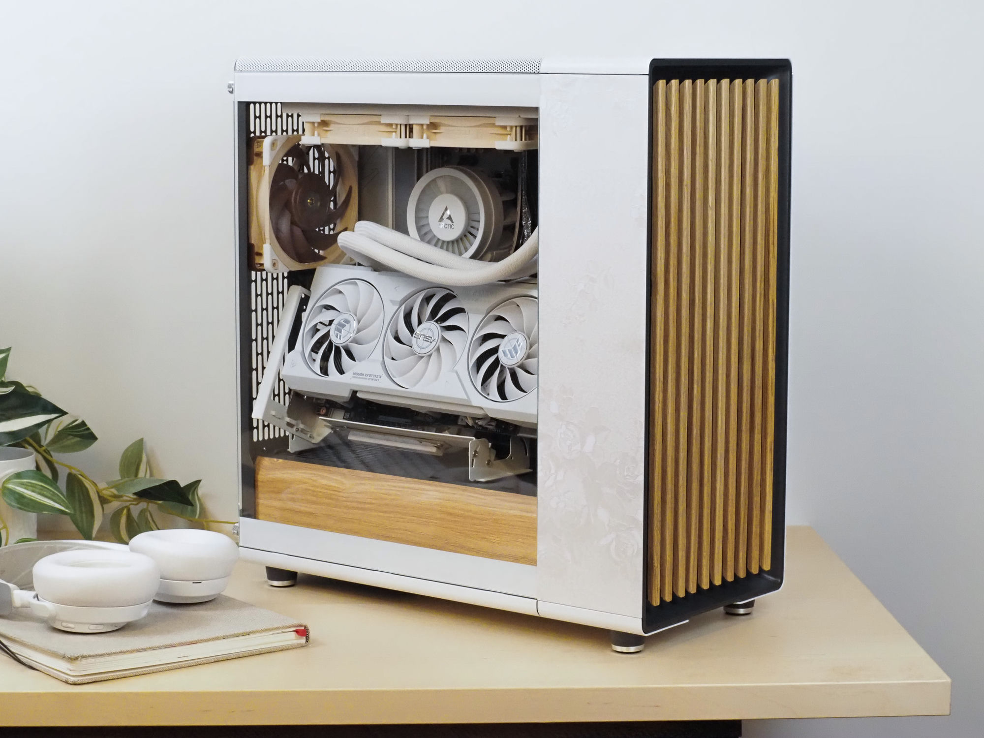 Lumiere — a white Fractal North build with vertical oak slats and rose-etched glass, on a bright desk