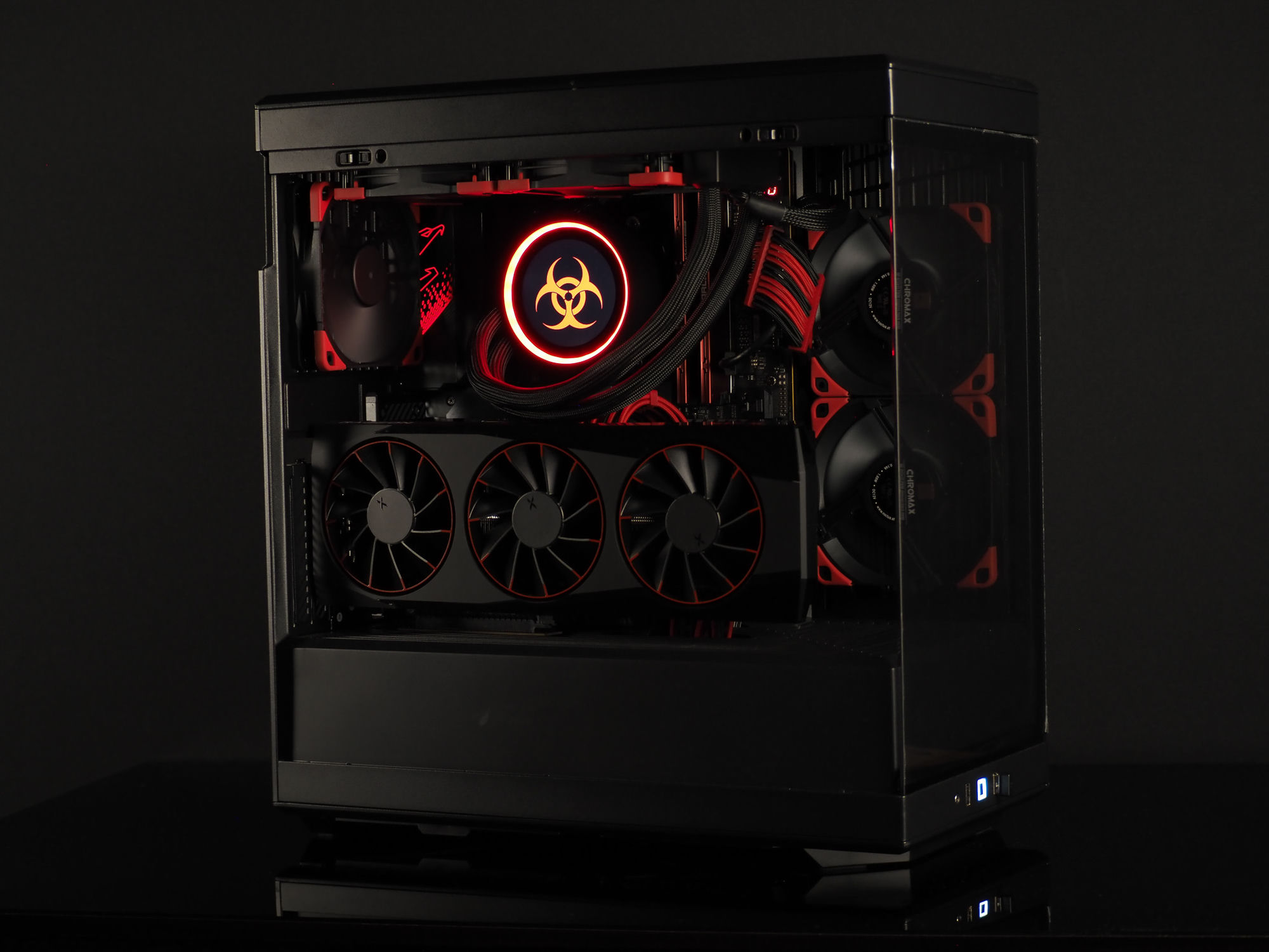 Containment — a blacked-out HYTE Y40 build with red accents and a glowing biohazard cooler face