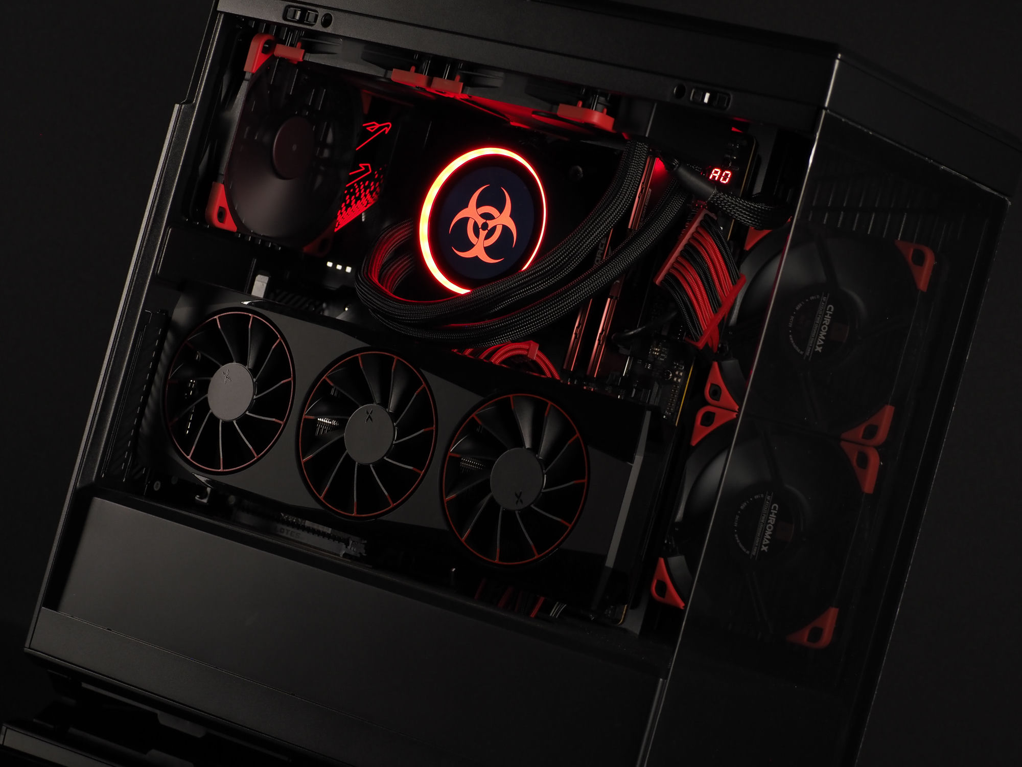 Containment beauty shot — a blacked-out HYTE Y40 build lit red, biohazard cooler glowing
