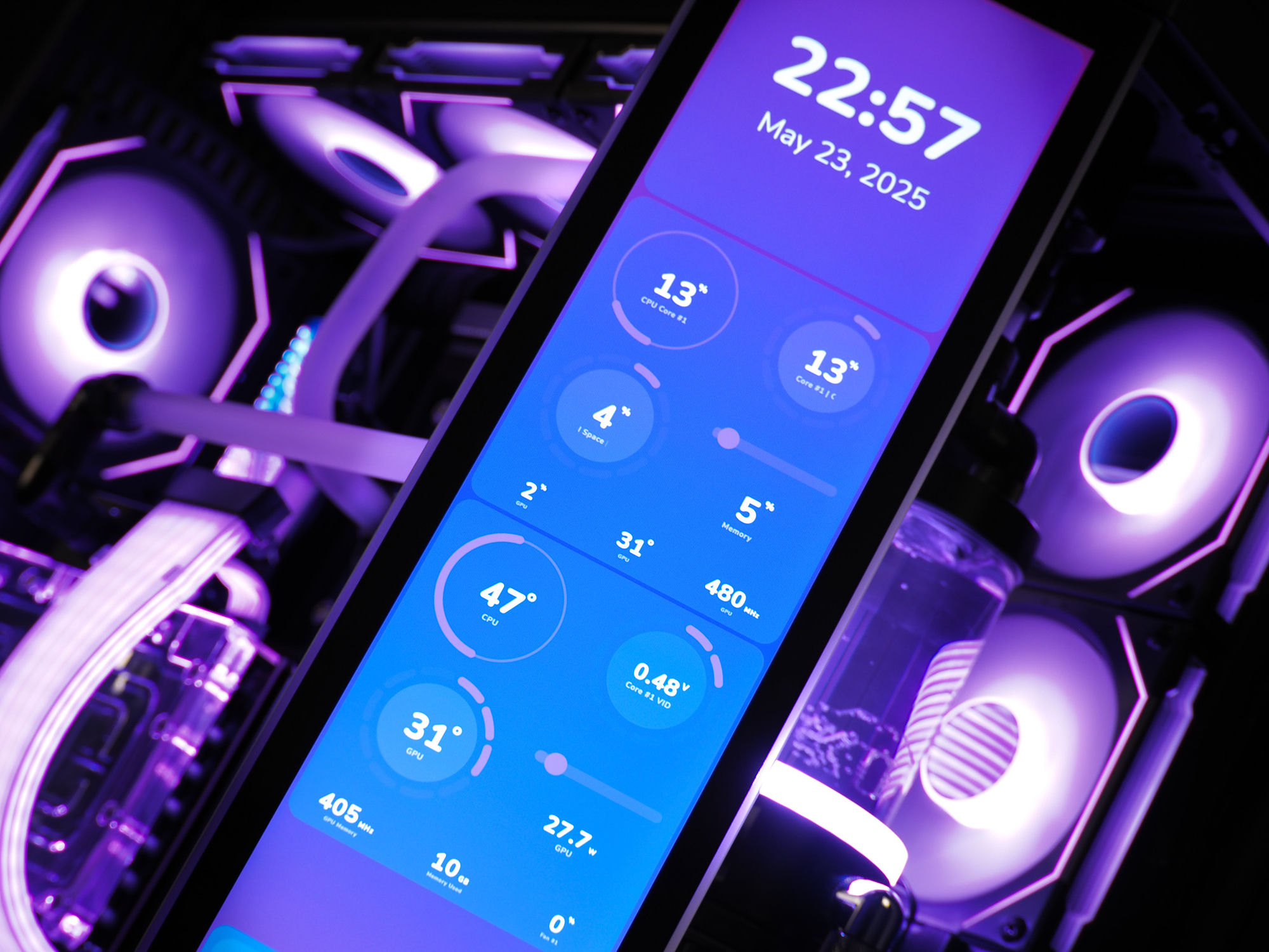The HYTE Y70 front touchscreen showing clock, date, and live CPU/GPU temperatures in purple