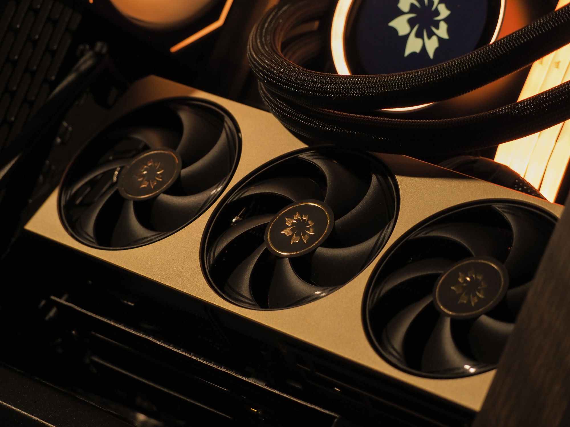 The brass-finished MSI Inspire graphics card with sakura-emblem fans