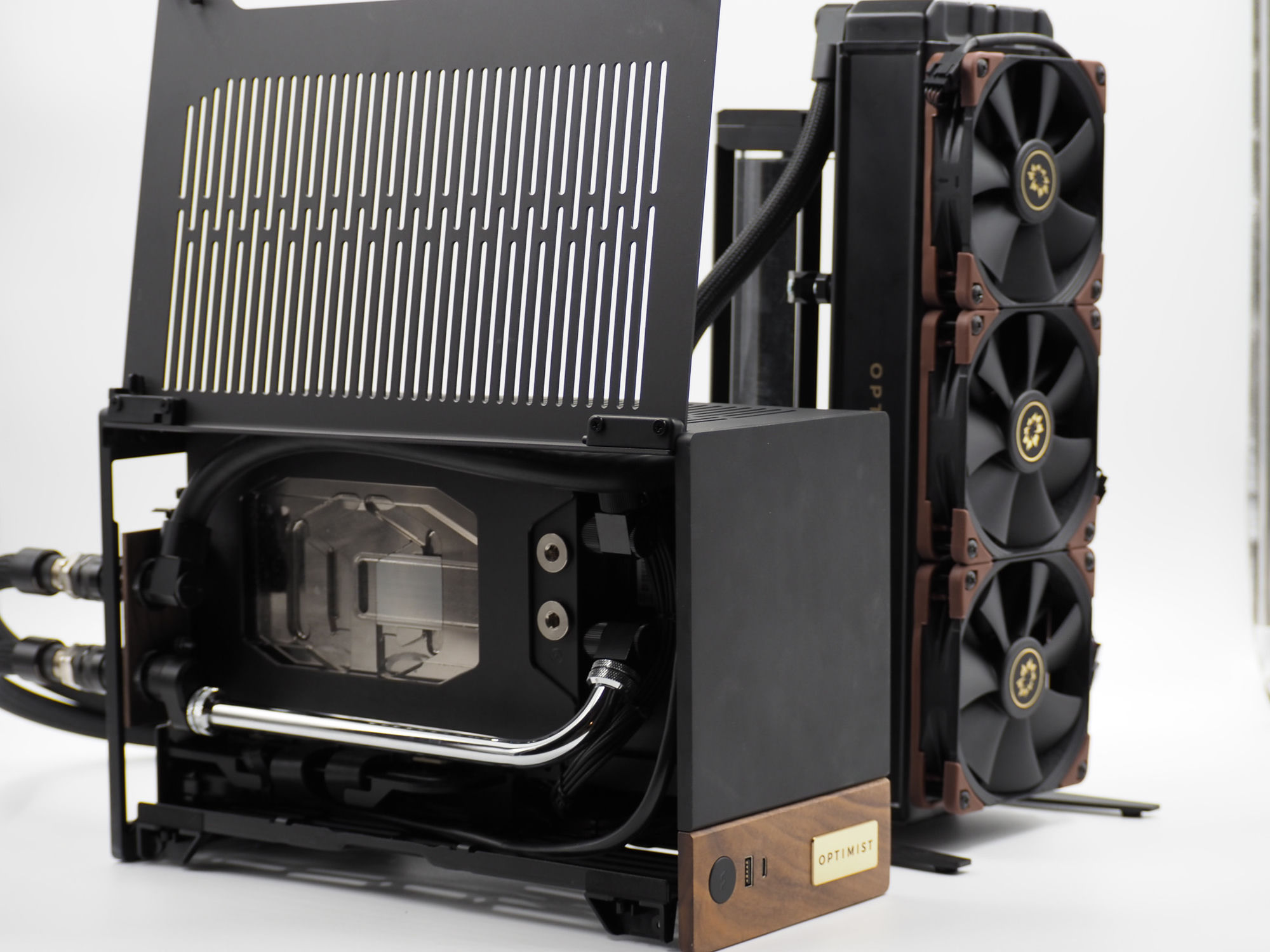 An Optimist SFF machine beside its standalone external radiator tower — the whole cooling loop lifted out of the computer and set next to it
