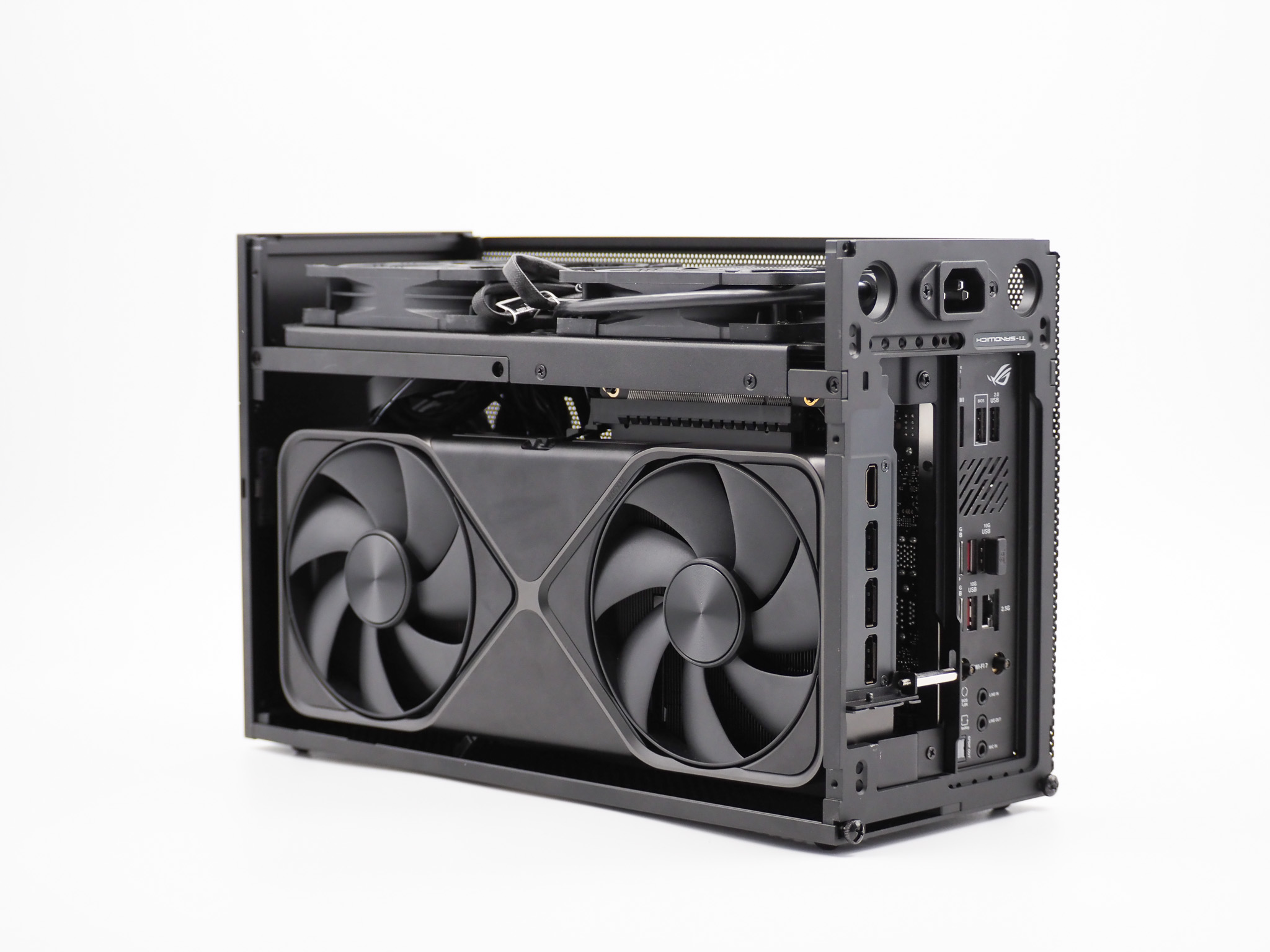 The Dusk — a compact FormD T1 small-form-factor machine with an ASUS ROG STRIX graphics card, shot on a white background