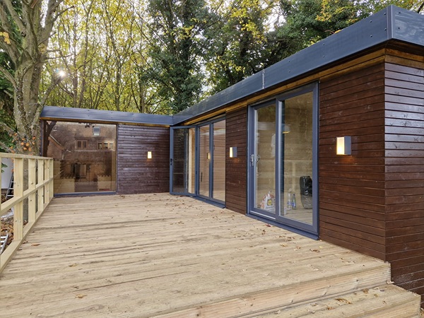 Bespoke garden room in a Warwickshire garden at golden hour