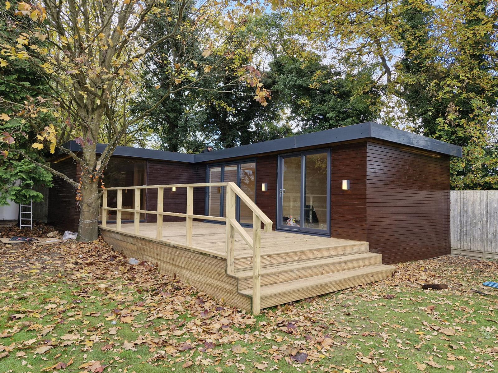 Bespoke garden room in a Warwickshire garden at golden hour