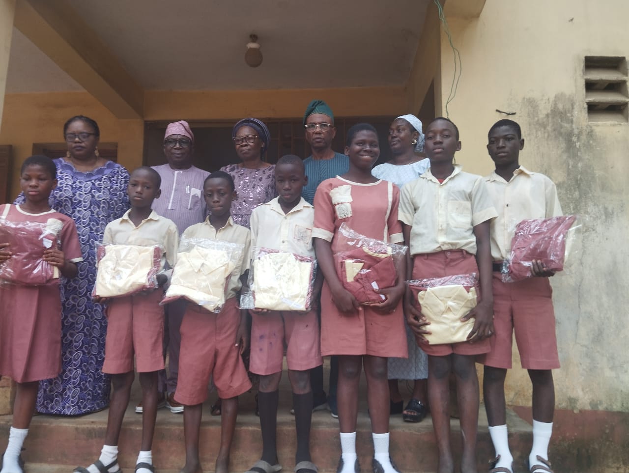 Students in school uniforms receiving support