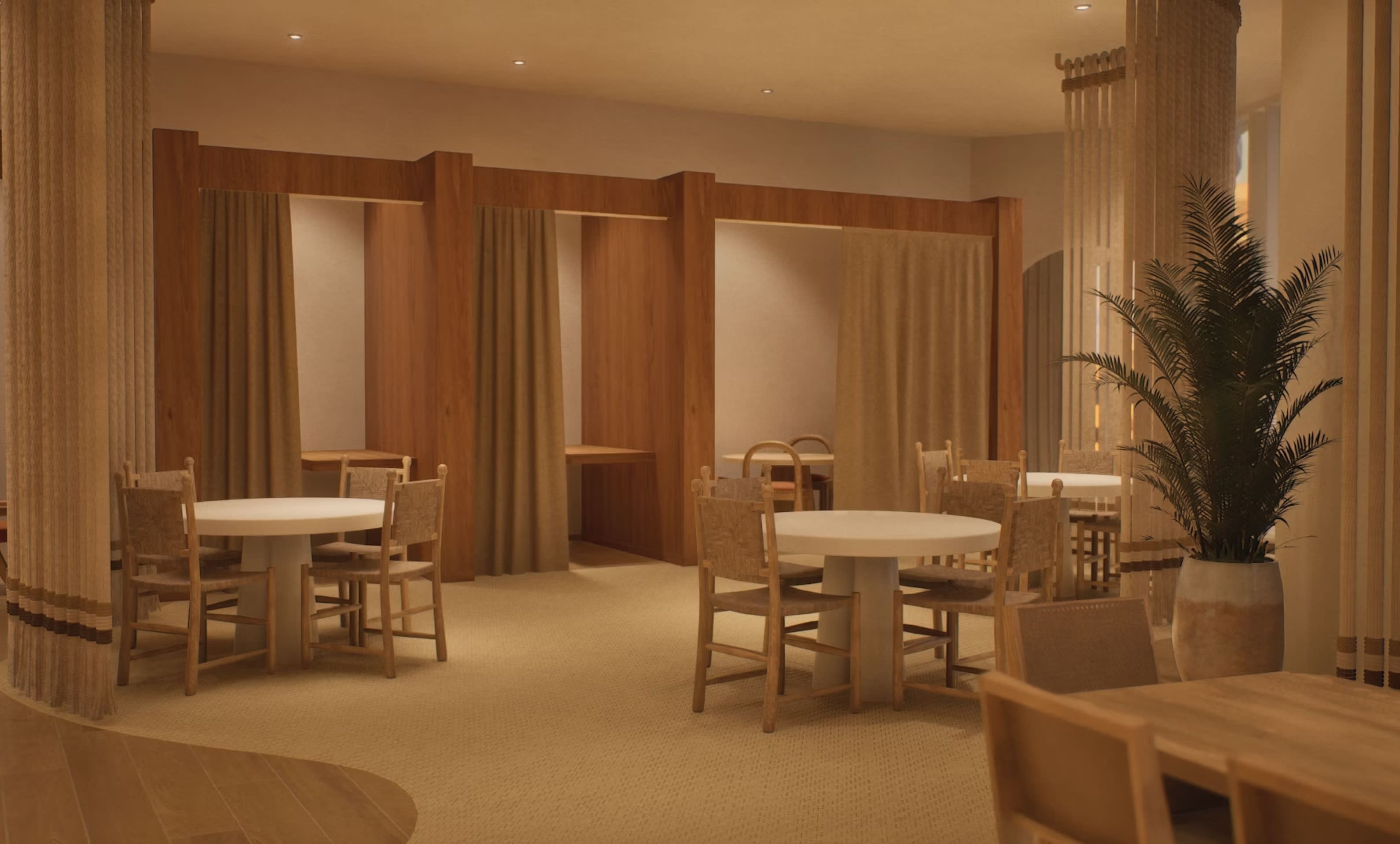 Common dining room with two round tables, wooden chairs, private wood-framed alcoves with curtains, potted palm plant, and warm lighting.