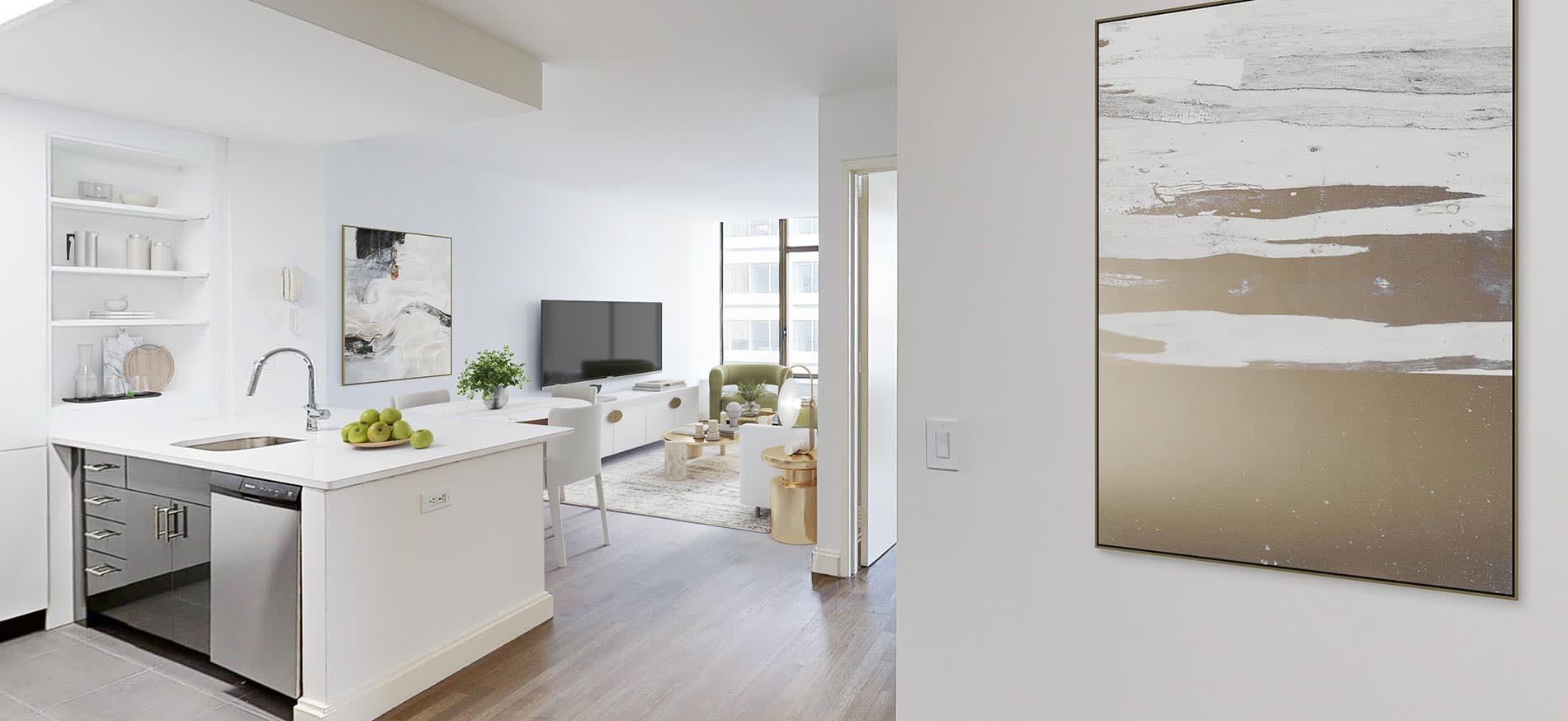 Open-concept kitchen and living room with white island, stainless steel appliances, floating shelves, and hardwood floors.