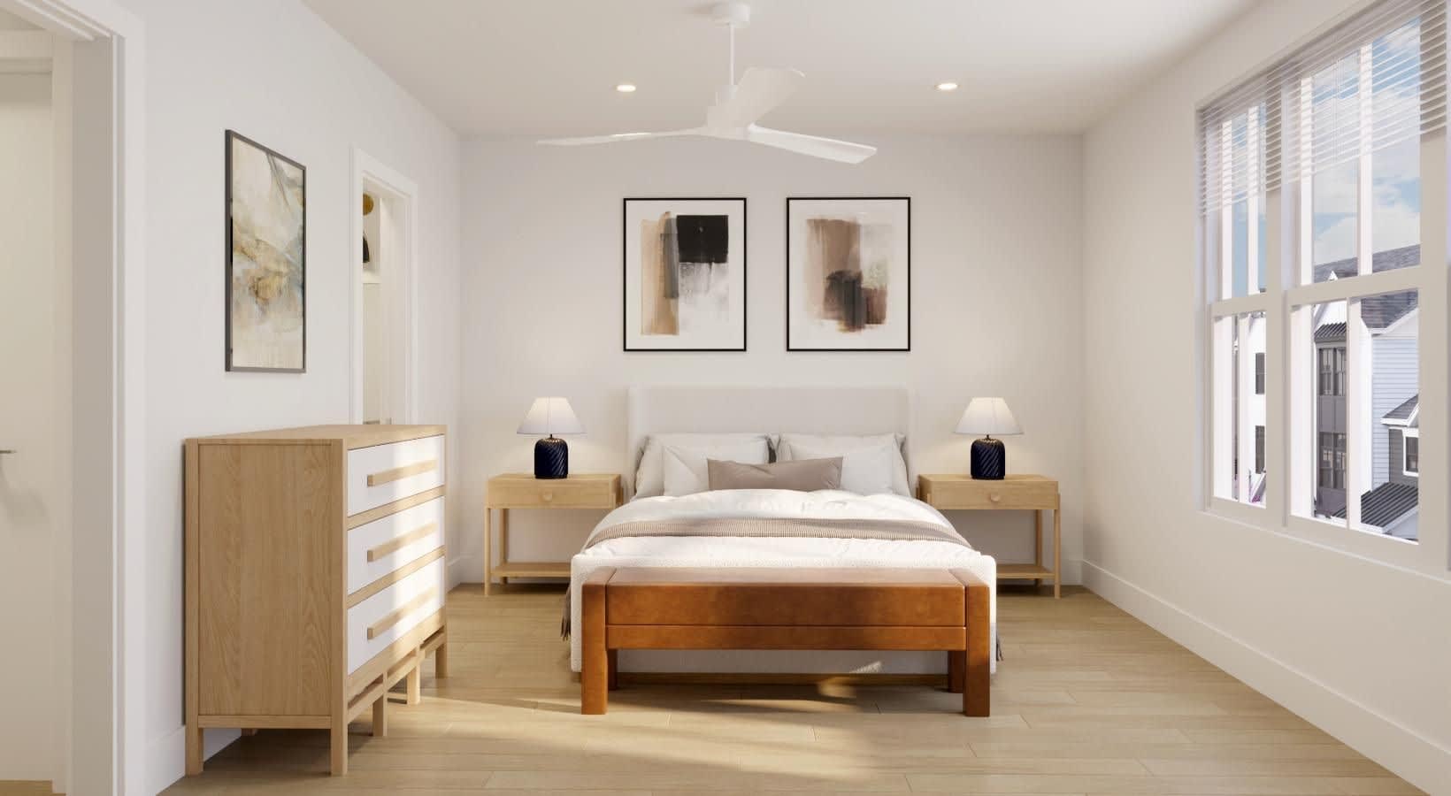 Spacious bedroom with wood bed frame, two wood nightstands with lamps, dresser, and large windows with natural light.