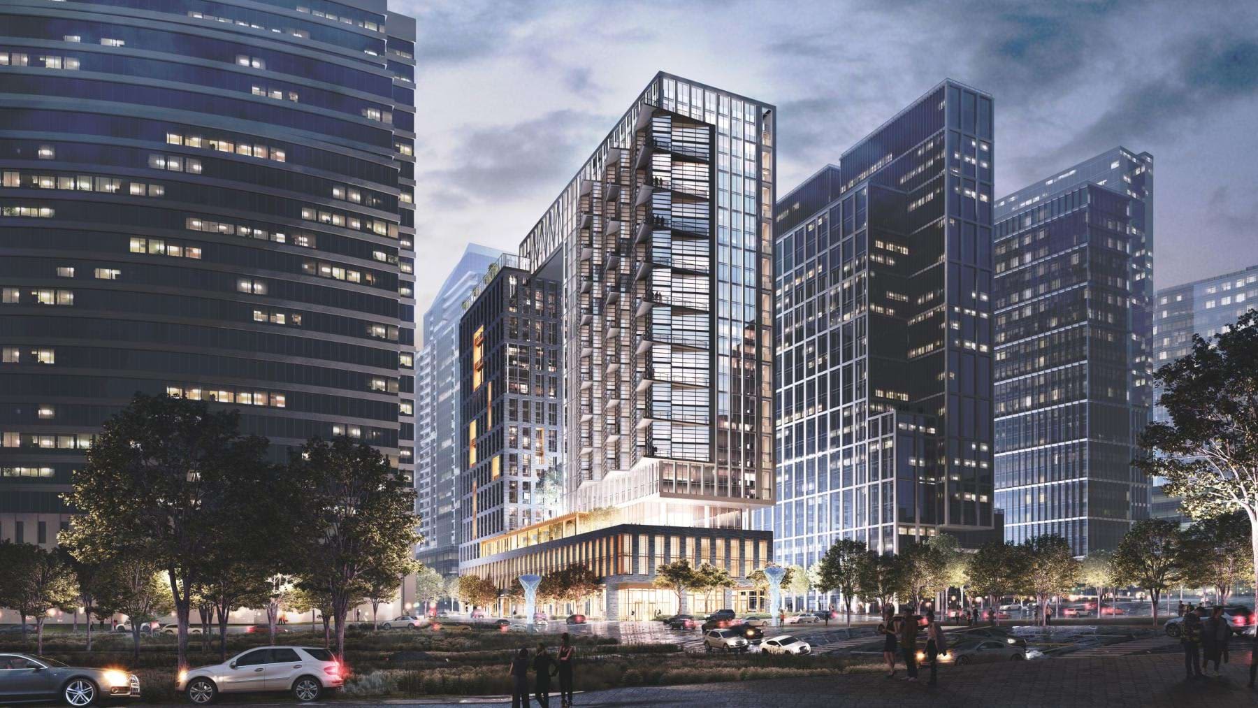 Modern mixed-use building with glass and metal facade surrounded by tall office towers, street-level retail, and landscaped plaza with pedestrians and parked cars.