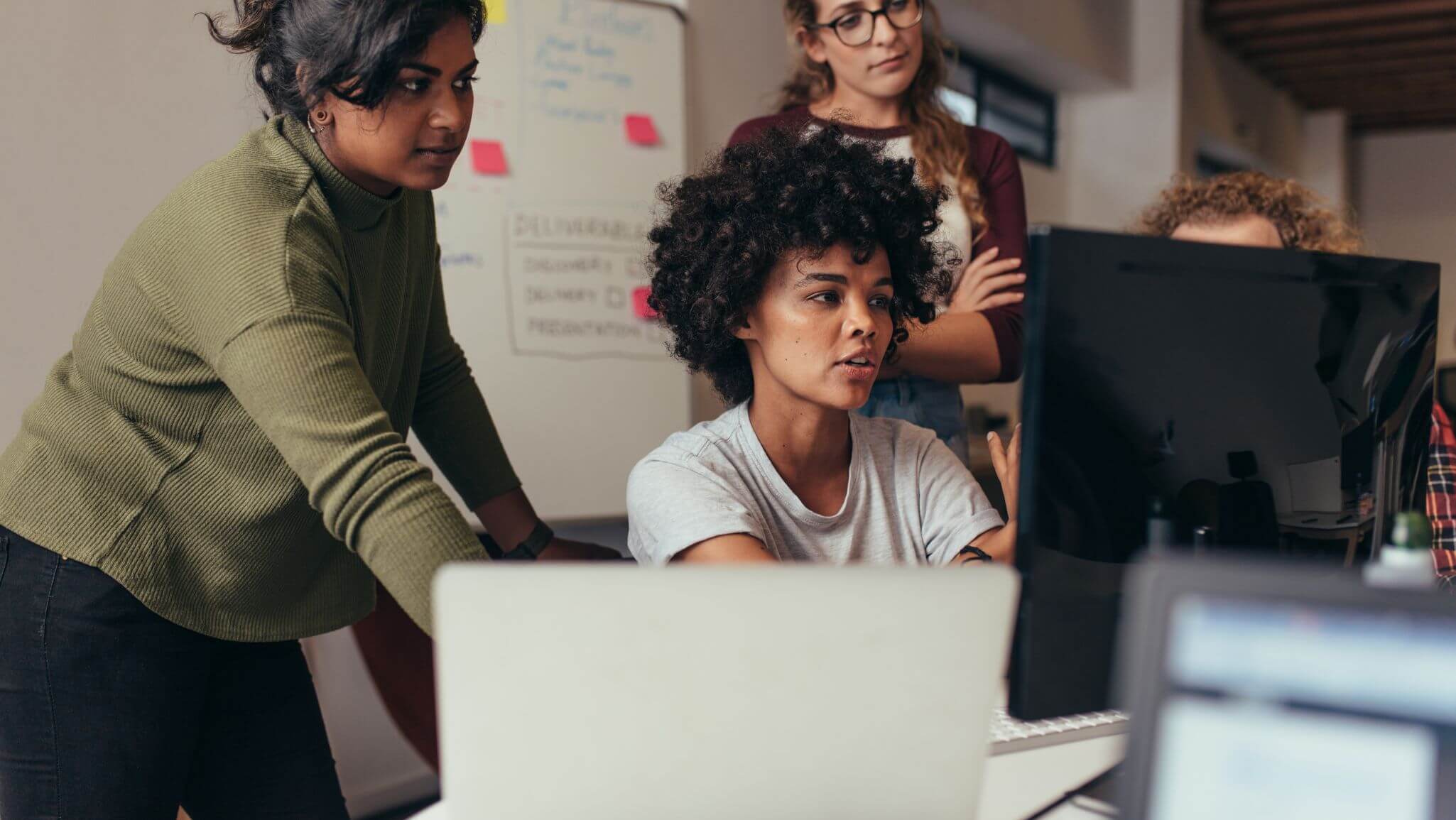 Woman in office watching screen