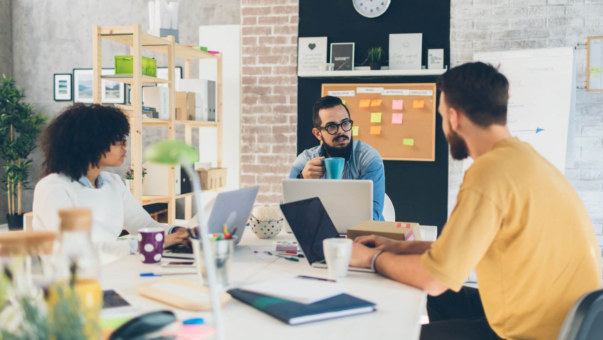 Three people in a meeting