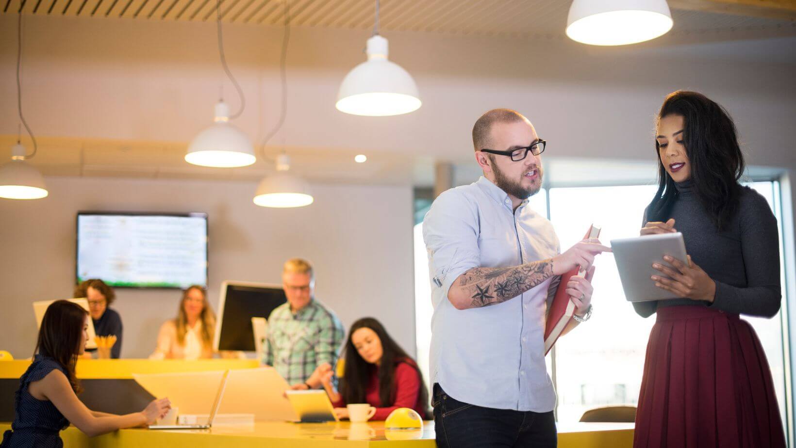 Two senior agency members talking about a proposal