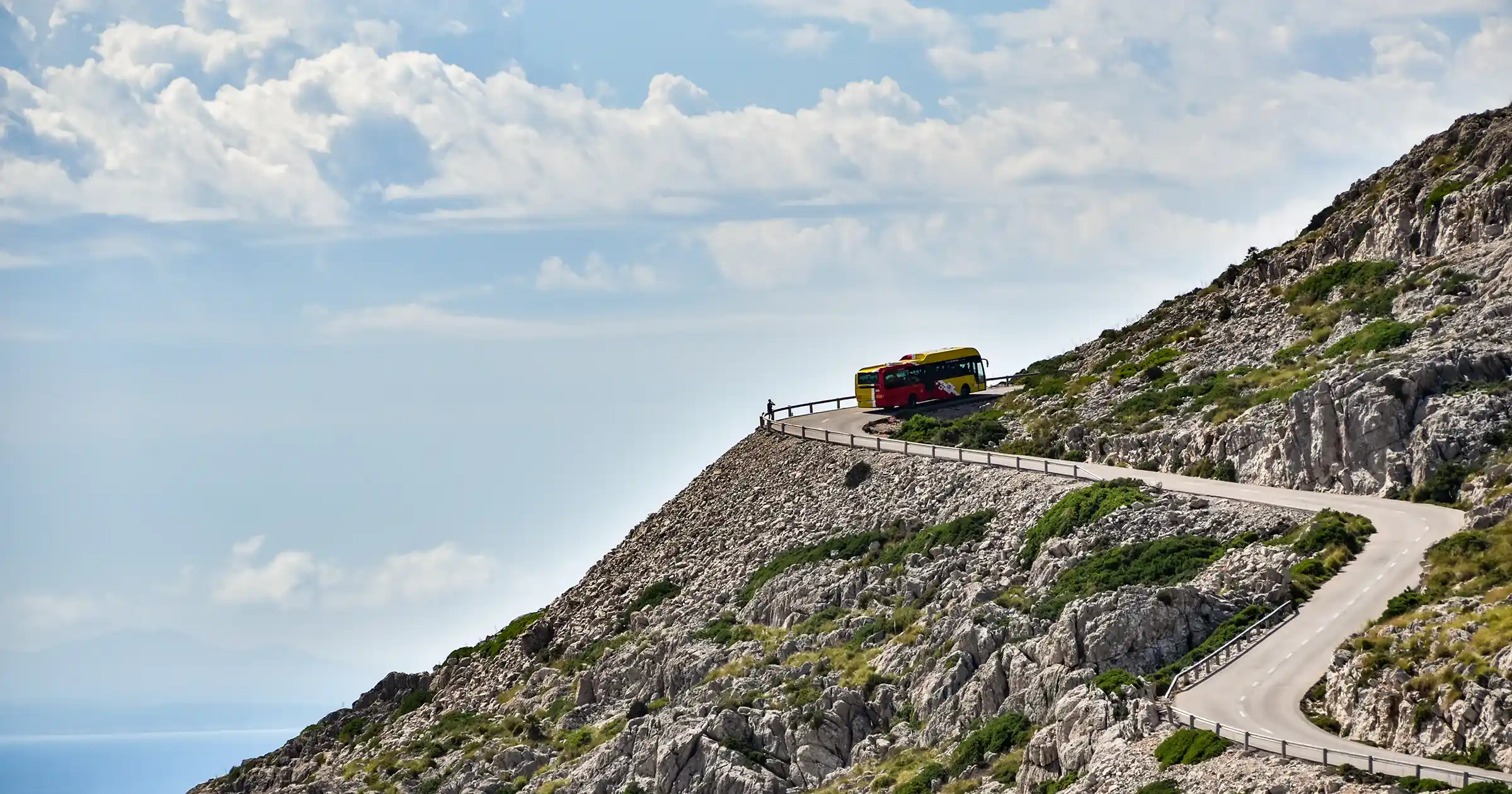 Bus going up a countryside hill