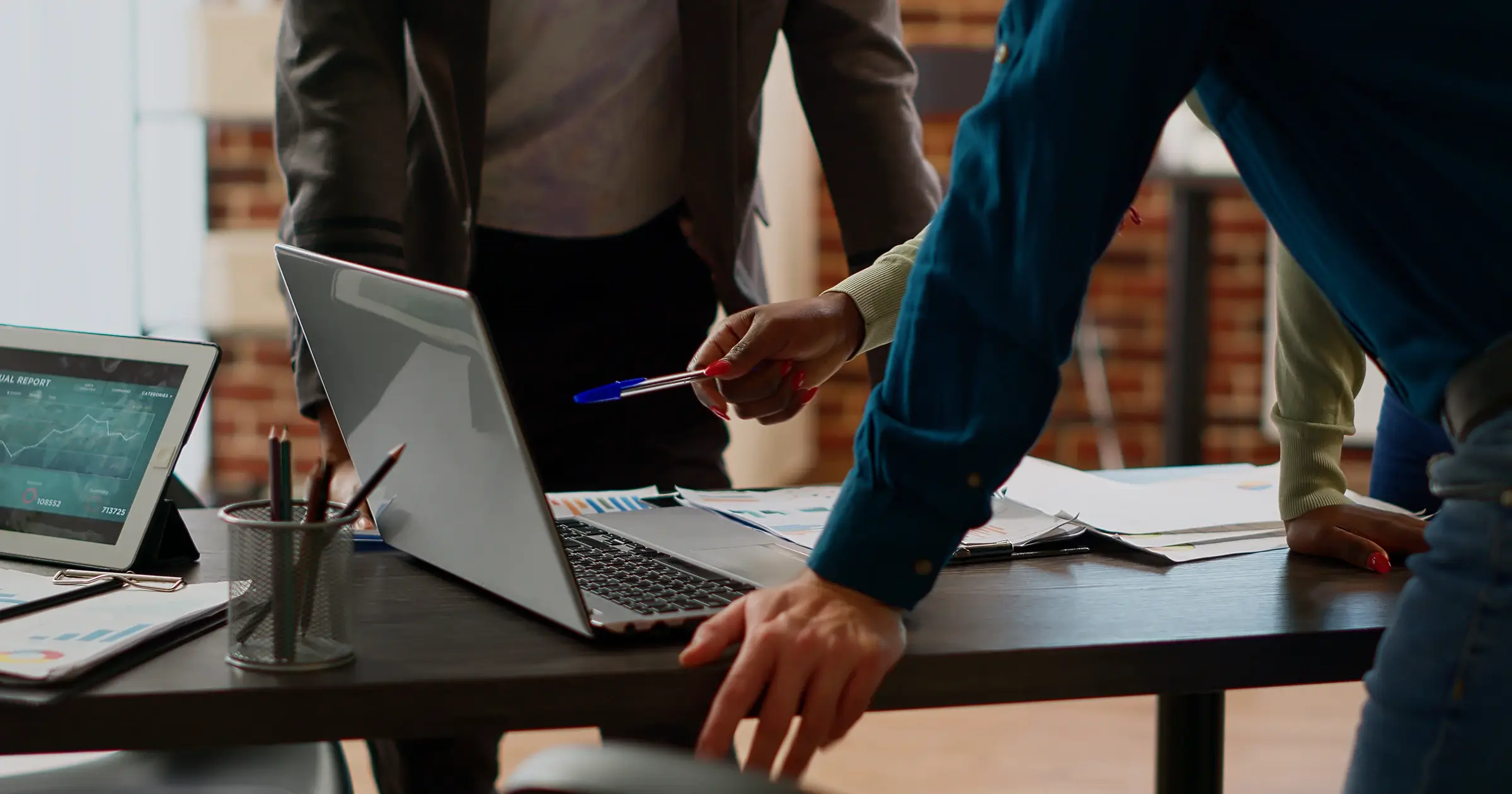 People discussing a project over a laptop