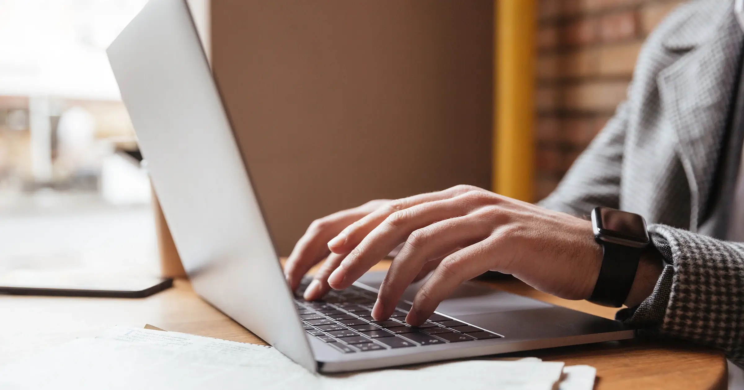 Woman typing on her laptop