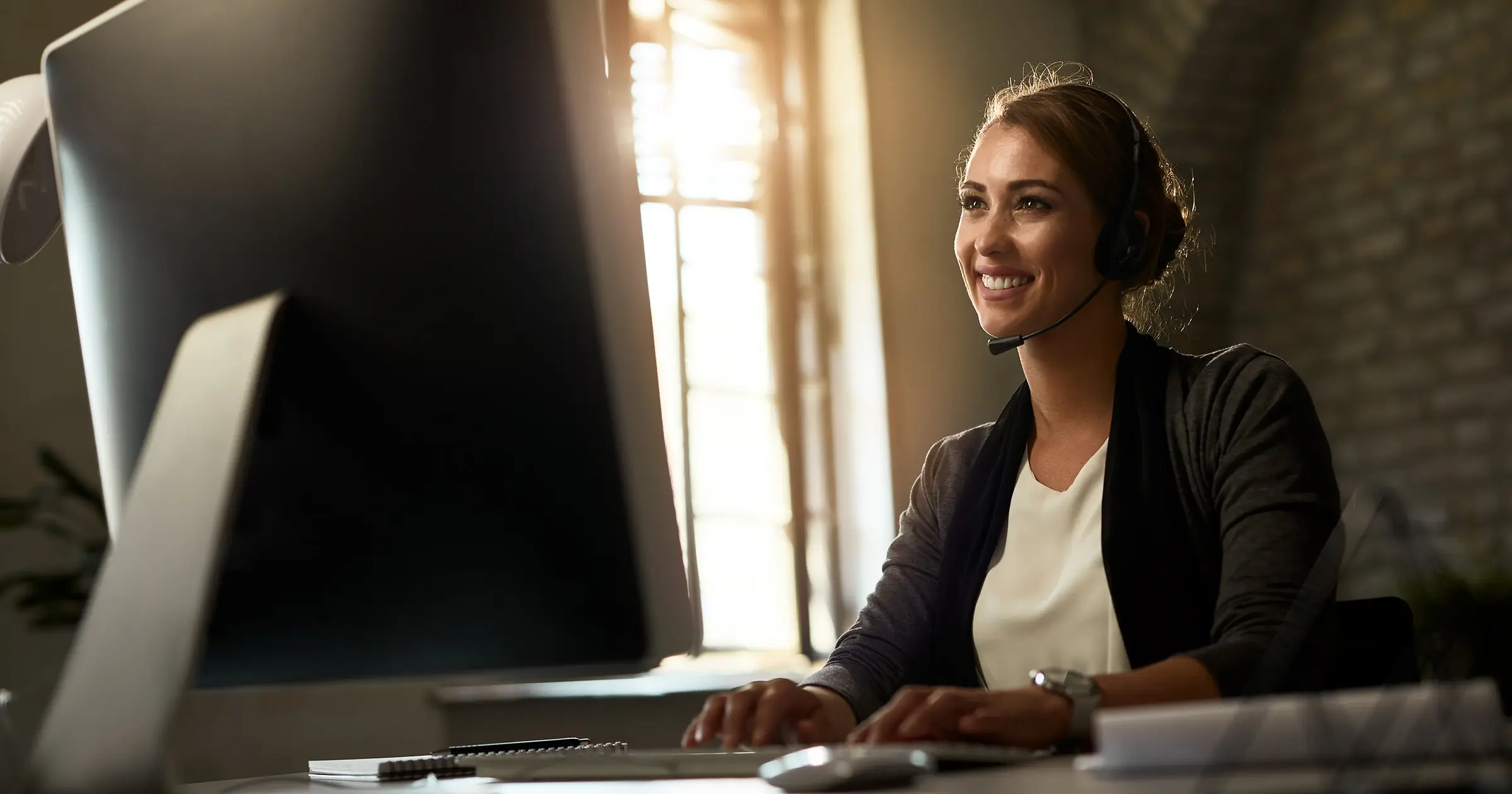 Woman smiling while on a conference call