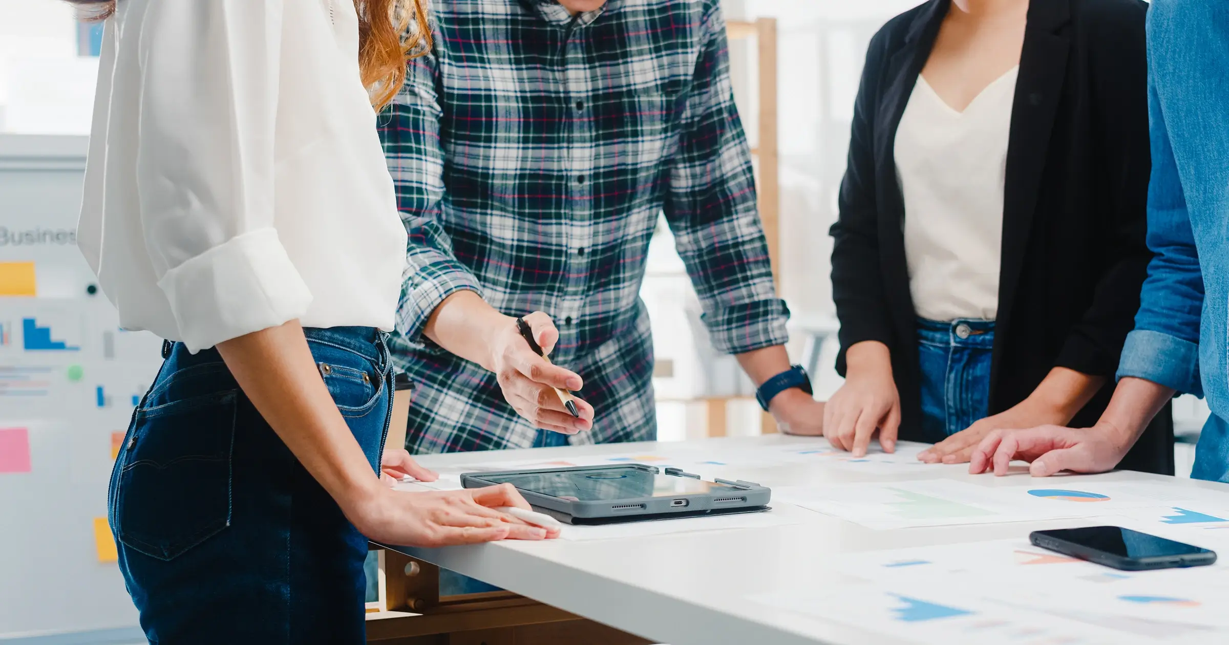 Agency team reviewing a project at a desk