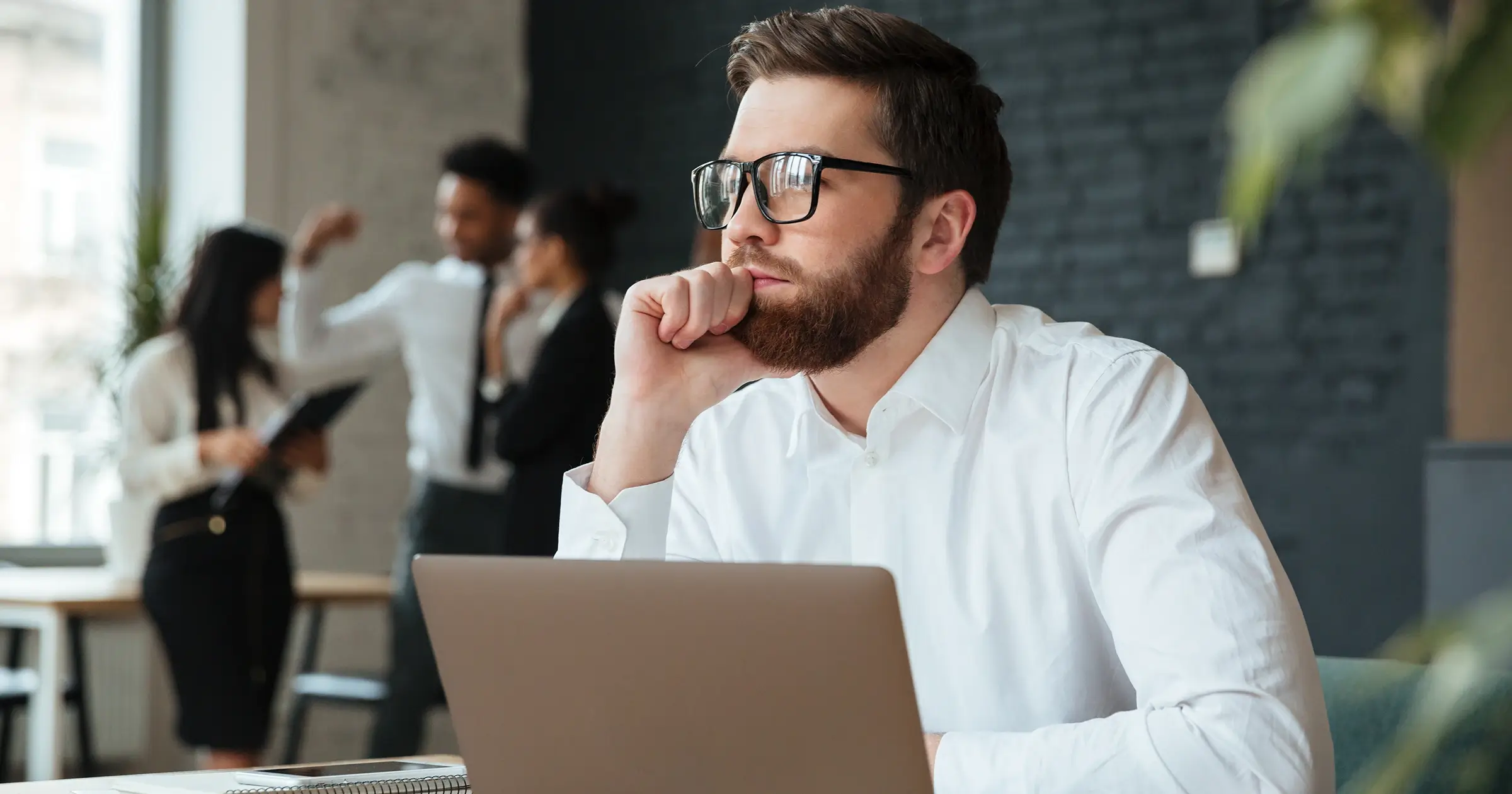 Person at work deep in thought