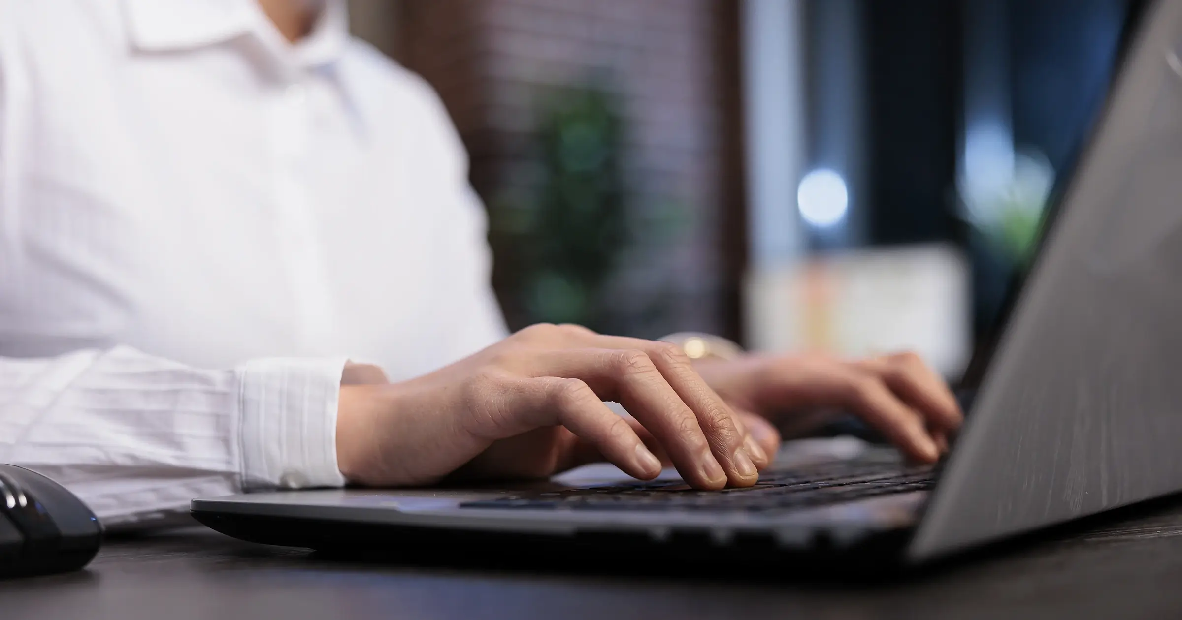 Girl typing on her laptop