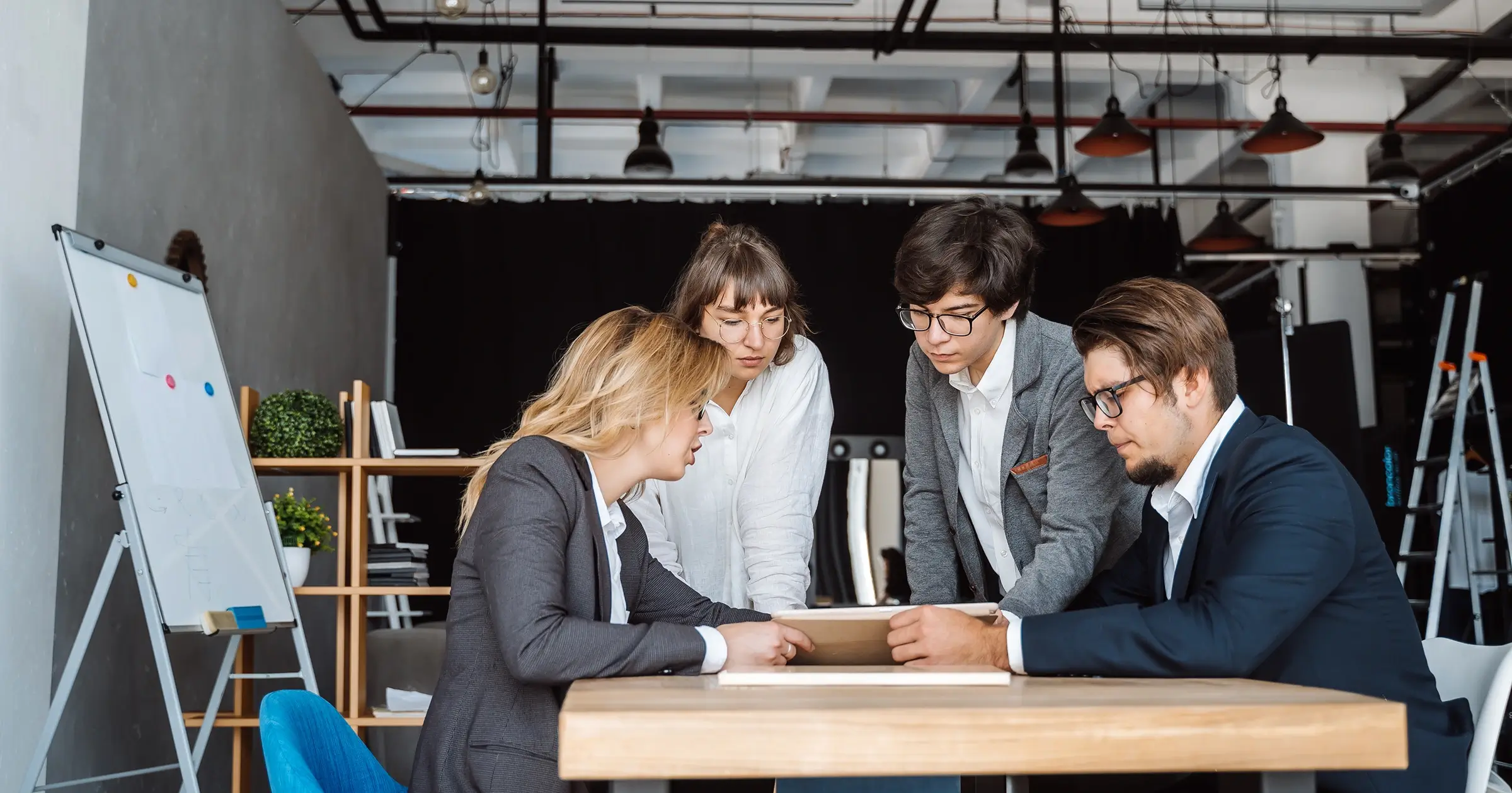 Group of people discussing a project in the office