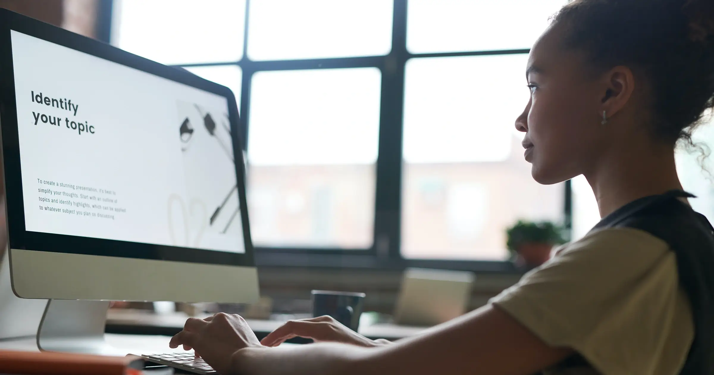 Woman looking at her screen at work