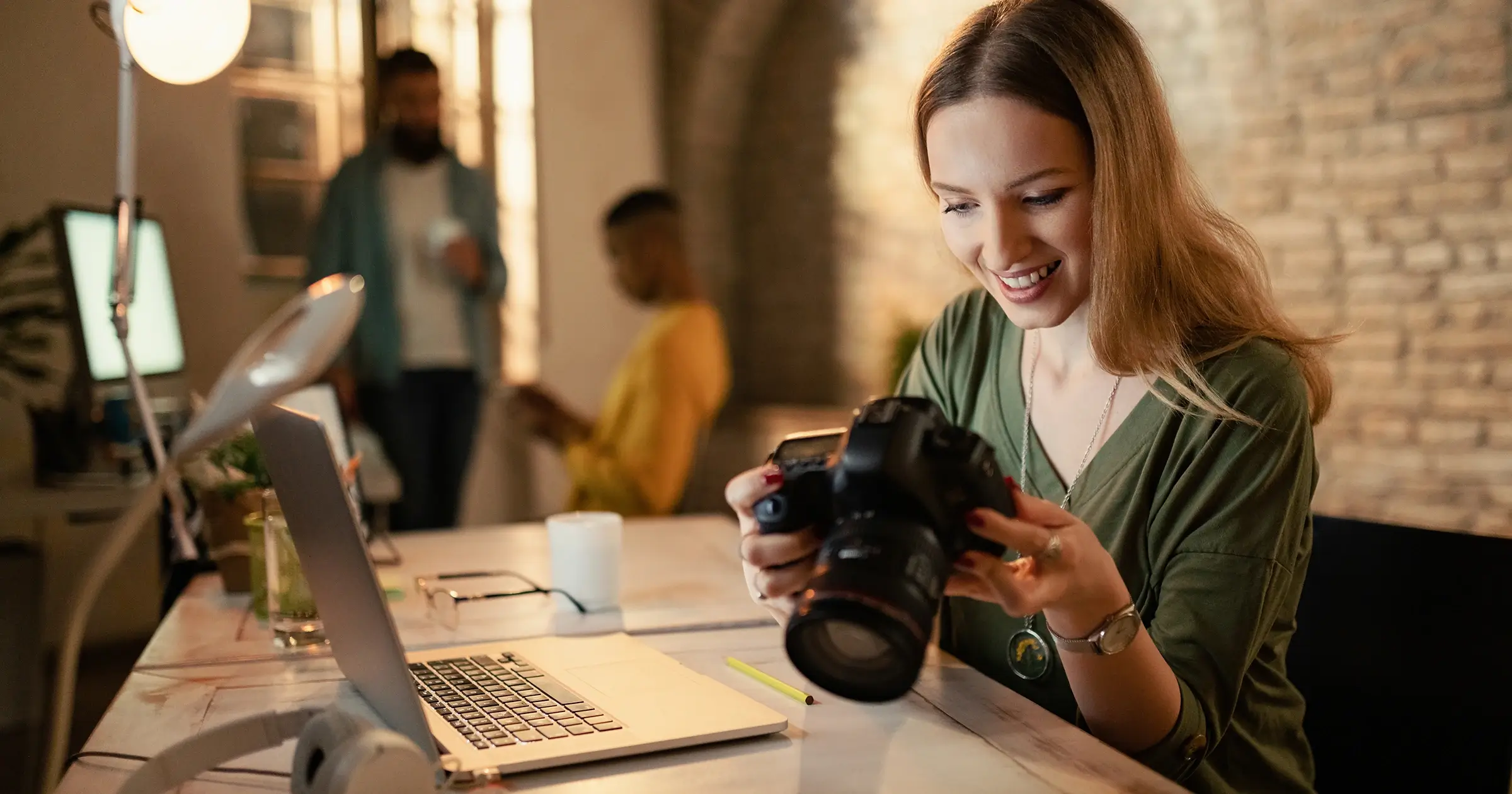 Freelance photographer looking at her camera