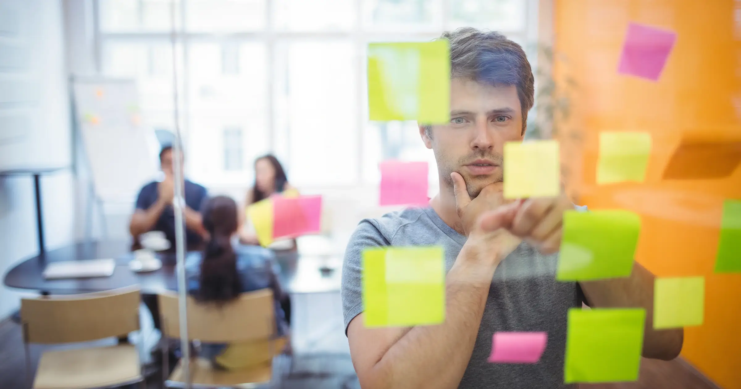 Office worker using sticky notes