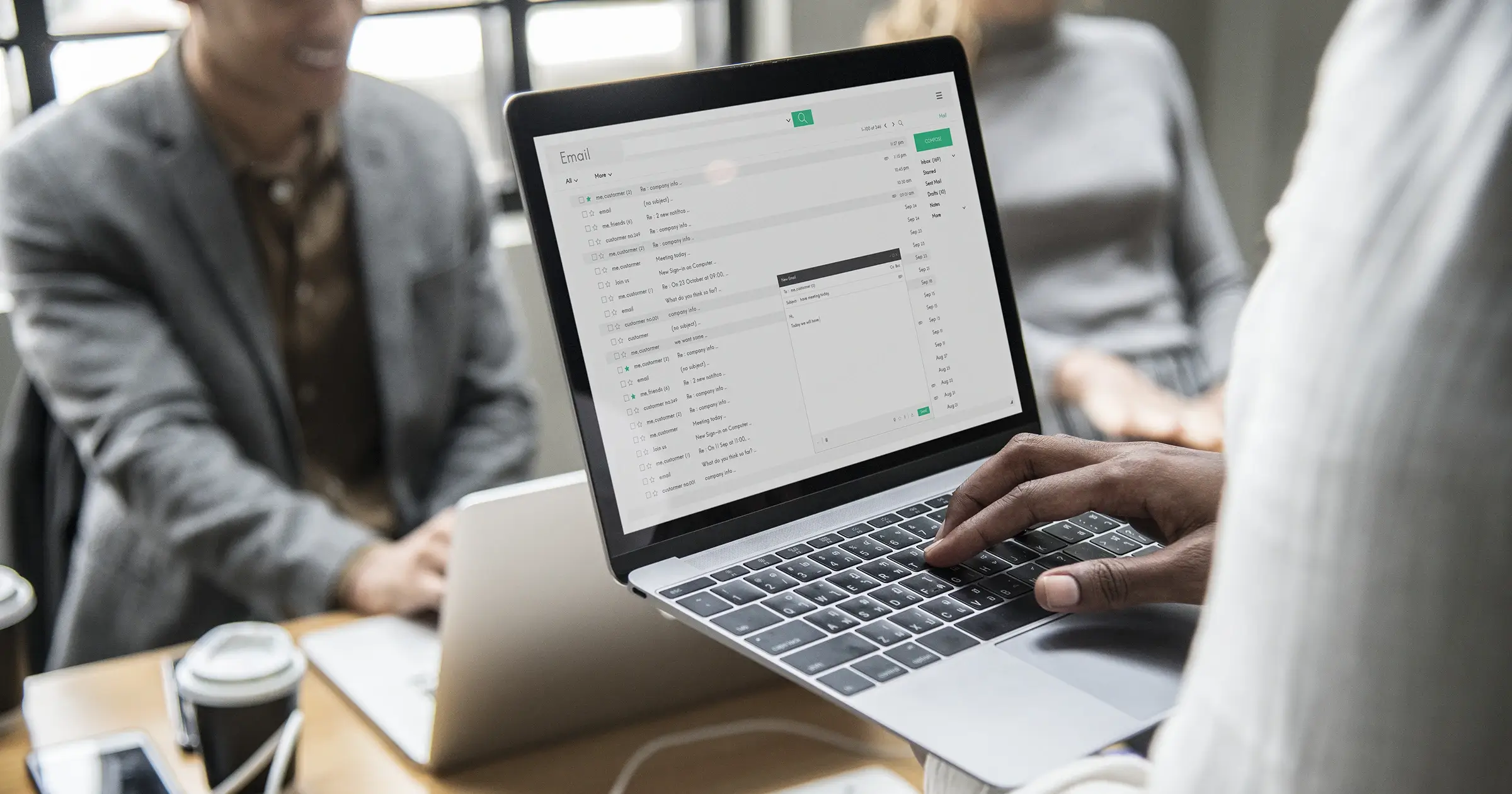 Guy checking his emails on a computer