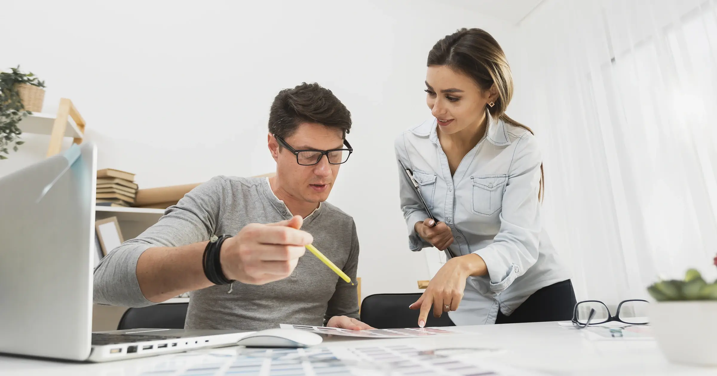 Man and woman discussing strategy at work