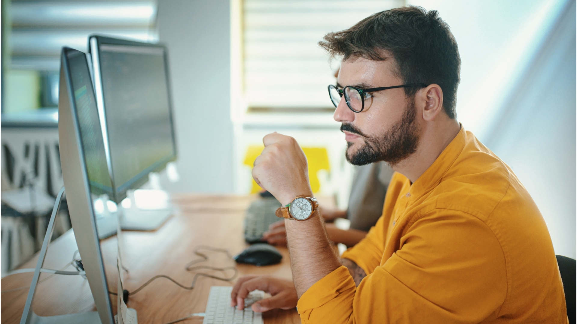 Man sitting behind a computer